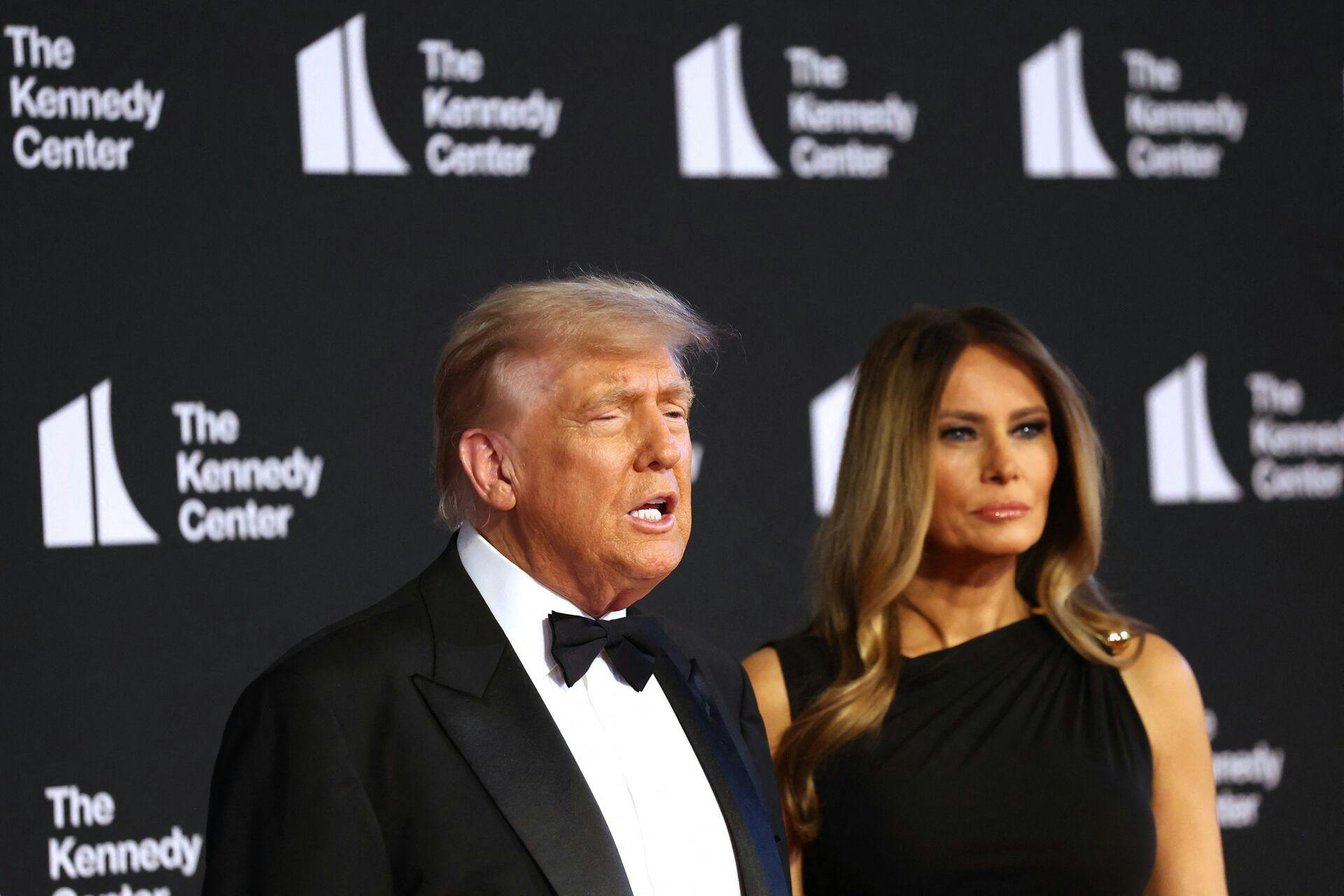 US President Donald Trump (L) and First Lady Melania Trump arrive to attend the opening night of "Les Miserables" at the Kennedy Center in Washington, DC, on June 11, 2025. (Photo by alex wroblewski / AFP)