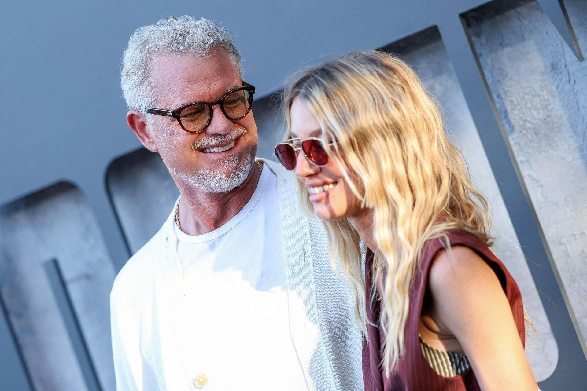 US actor Eric Dane and filmmaker Janell Shirtcliff attend Prime Video's "Countdown" premiere at the Harmony Gold theatre in Los Angeles on June 18, 2025. (Photo by VALERIE MACON / AFP)