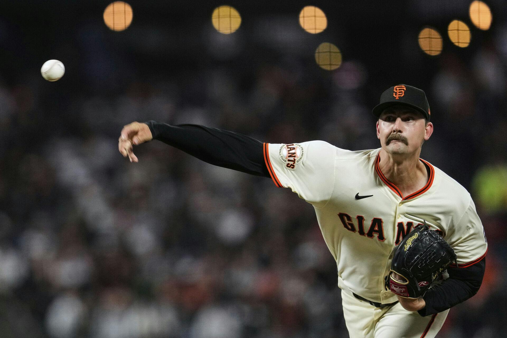 San Francisco Giants pitcher Sean Hjelle throws to a Cleveland Guardians batter during the eighth inning of a baseball game Wednesday, June 18, 2025, in San Francisco. (AP Photo/Godofredo A. Vásquez)