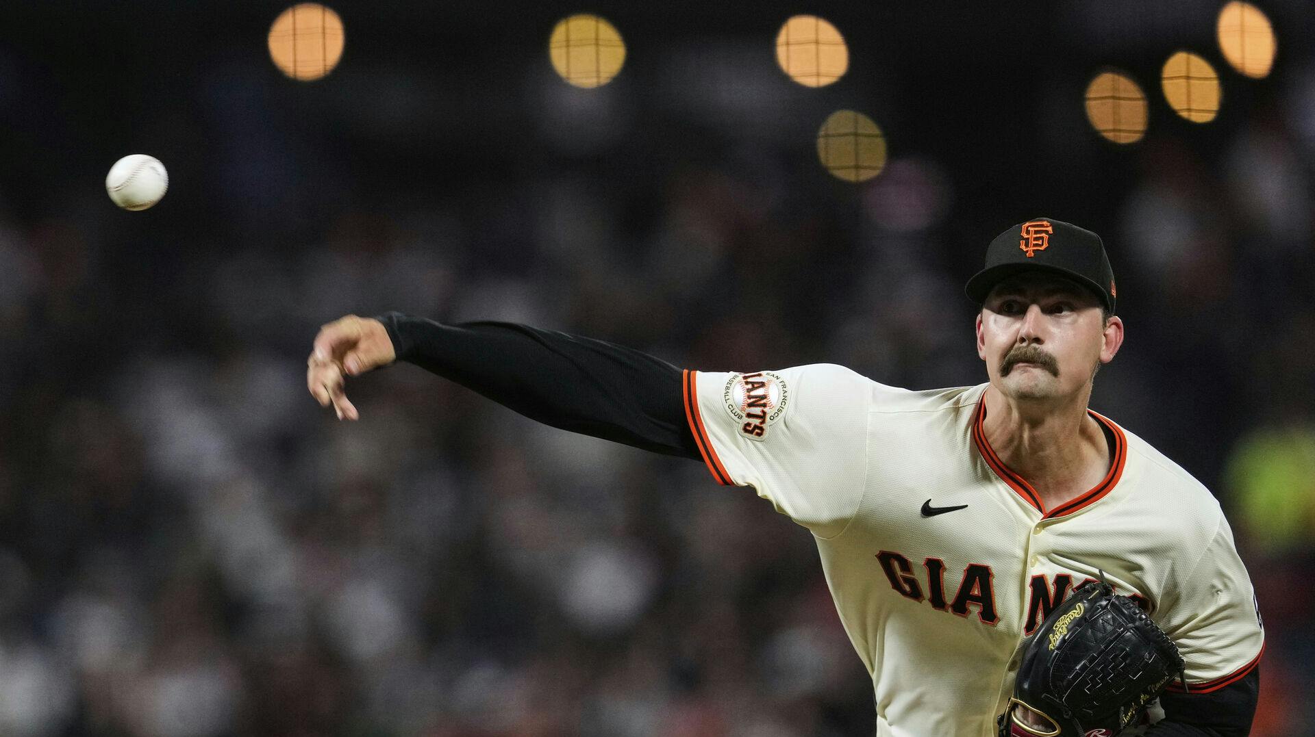 San Francisco Giants pitcher Sean Hjelle throws to a Cleveland Guardians batter during the eighth inning of a baseball game Wednesday, June 18, 2025, in San Francisco. (AP Photo/Godofredo A. Vásquez)