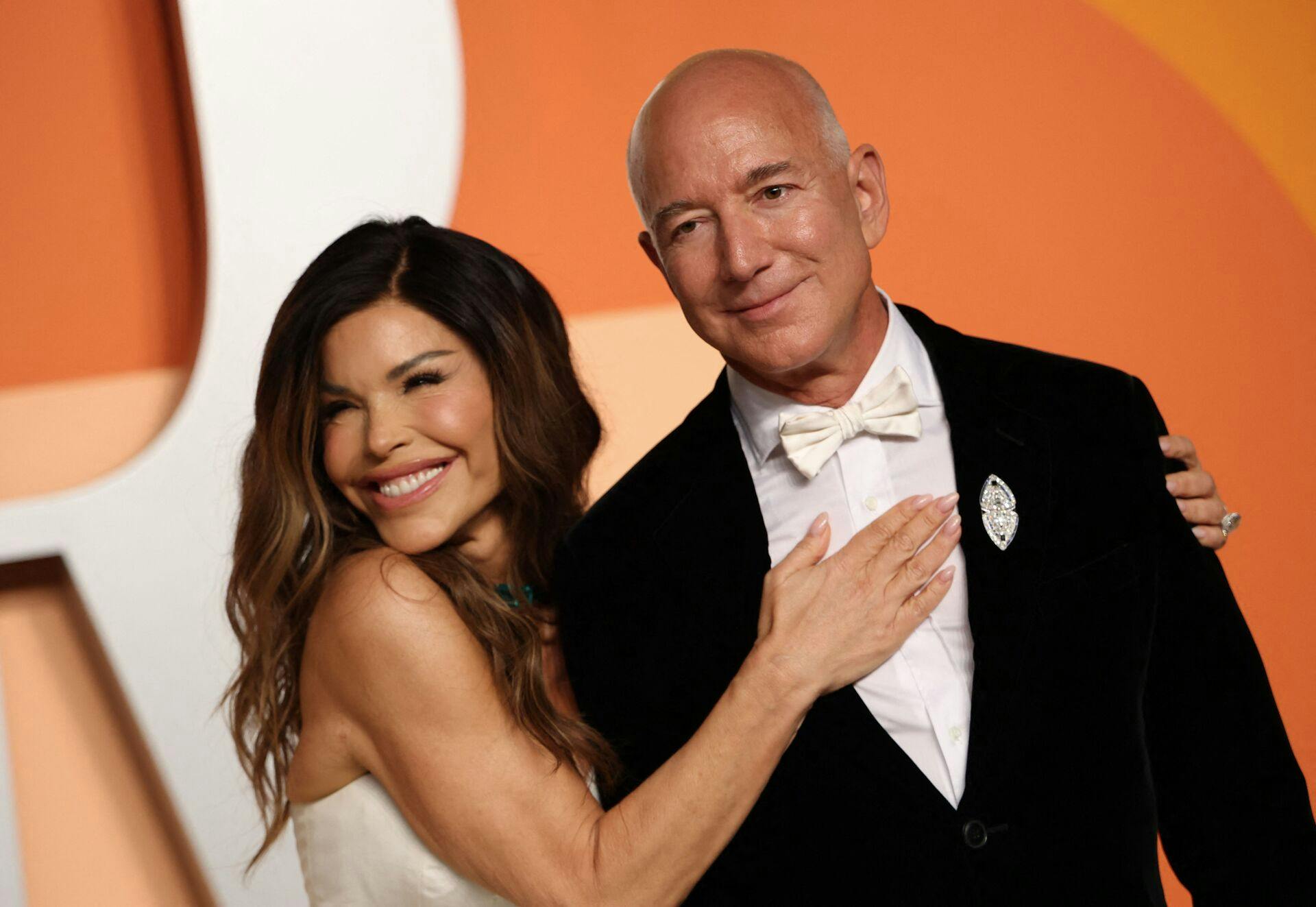(FILES) CEO of Amazon Jeff Bezos and partner Lauren Sanchez attend the Vanity Fair Oscar Party at the Wallis Annenberg Center for the Performing Arts in Beverly Hills, California, on March 2, 2025. Venice will host the wedding of Amazon Founder and CEO Jeff Bezos and journalist Lauren Sanchez before the end of June 2025 with more than 200 guests expected to attend. (Photo by Michael Tran / AFP)