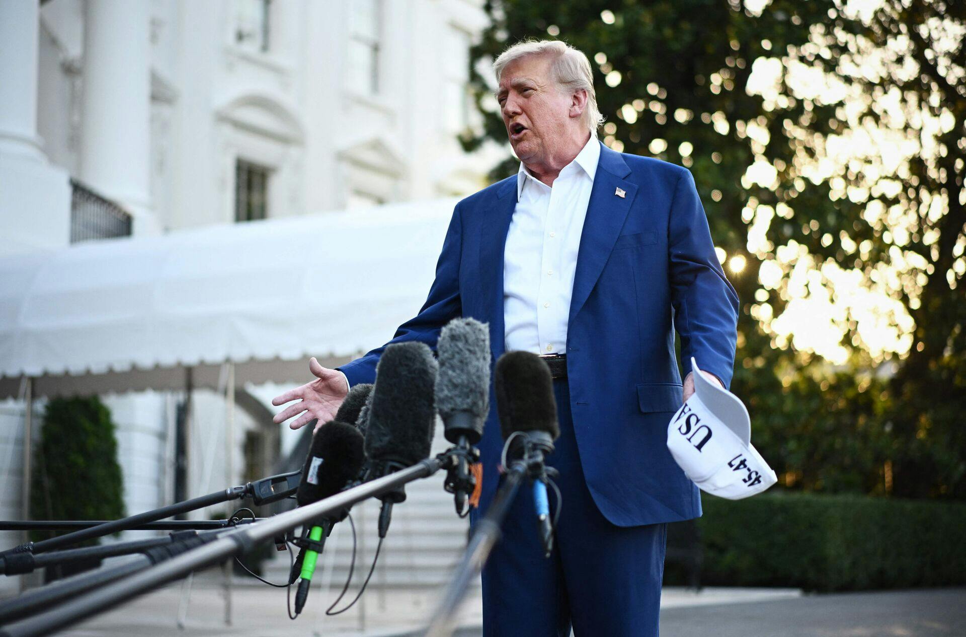 US President Donald Trump speaks to the press before boarding Marine One from the South Lawn of the White House in Washington, DC on June 24, 2025, to attend the NATO's Heads of State and Government summit in The Hague. (Photo by Mandel NGAN / AFP)