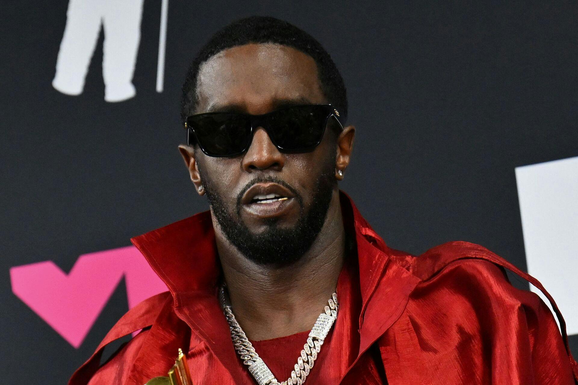 (FILES) US producer-musician Sean "Diddy" Combs poses with th