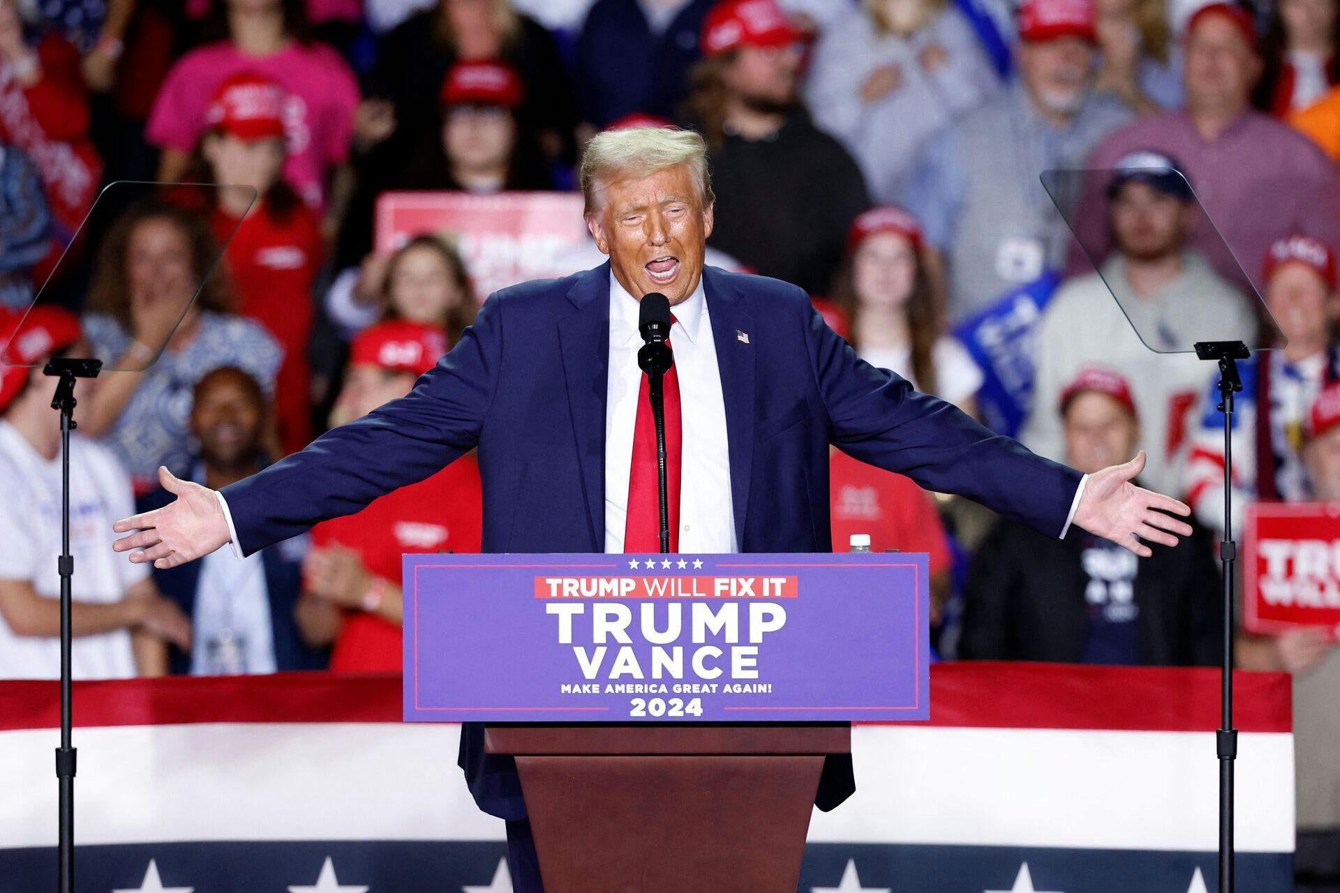 TOPSHOT - Former US President and Republican presidential candidate Donald Trump speaks during a campaign rally at Van Andel Arena in Grand Rapids, Michigan on November 5, 2024. (Photo by KAMIL KRZACZYNSKI / AFP)