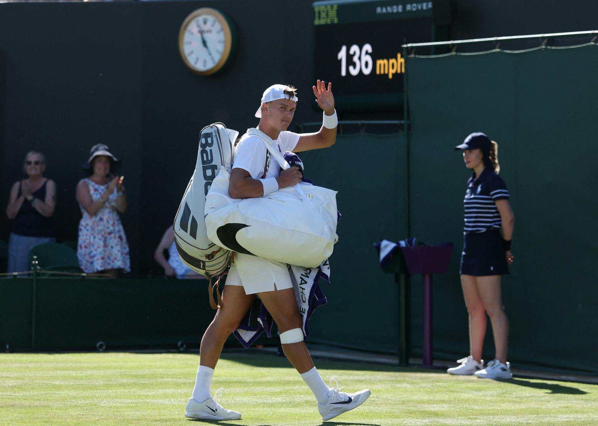 Tennis - Wimbledon - All England Lawn Tennis and Croquet Club, London, Britain - June 30, 2025 Denmark's Holger Rune waves as he leaves the court after losing his first round match against Chile's Nicolas Jarry REUTERS/Toby Melville TPX IMAGES OF THE DAY