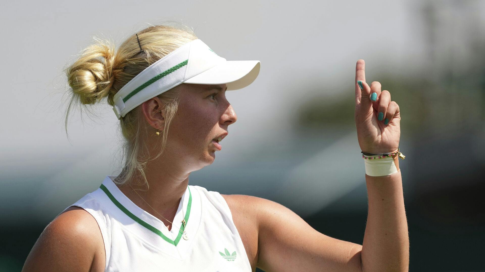 Clara Tauson of Denmark reacts during her women's first round single's match against Heather Watson of Britain at the Wimbledon Tennis Championships in London, Tuesday, July 1, 2025.(AP Photo/Joanna Chan)