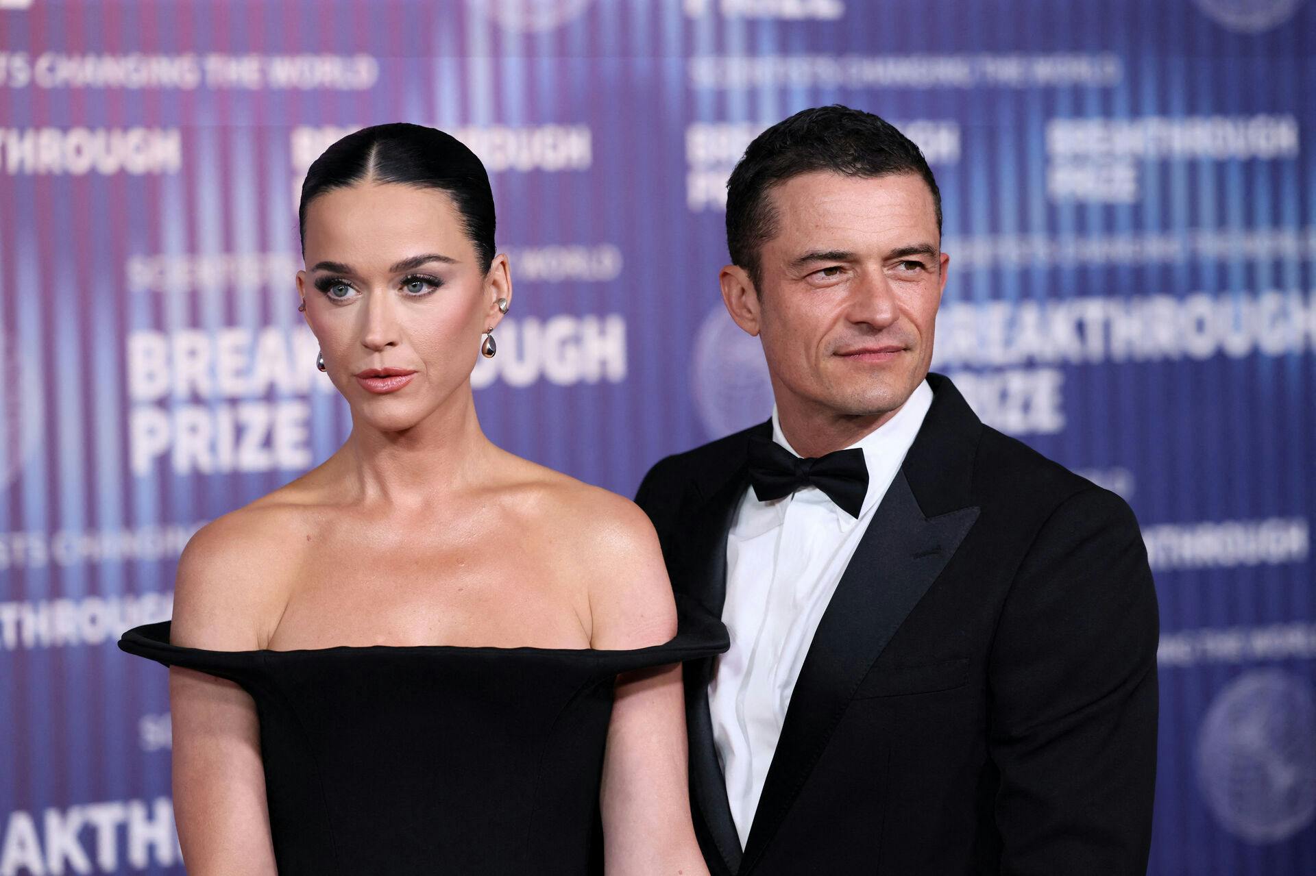 US singer Katy Perry (L) and English actor Orlando Bloom arrive at the Tenth Breakthrough Prize Ceremony at the Academy Museum of Motion Pictures in Los Angeles, California, on April 13, 2024.  Etienne Laurent / AFP