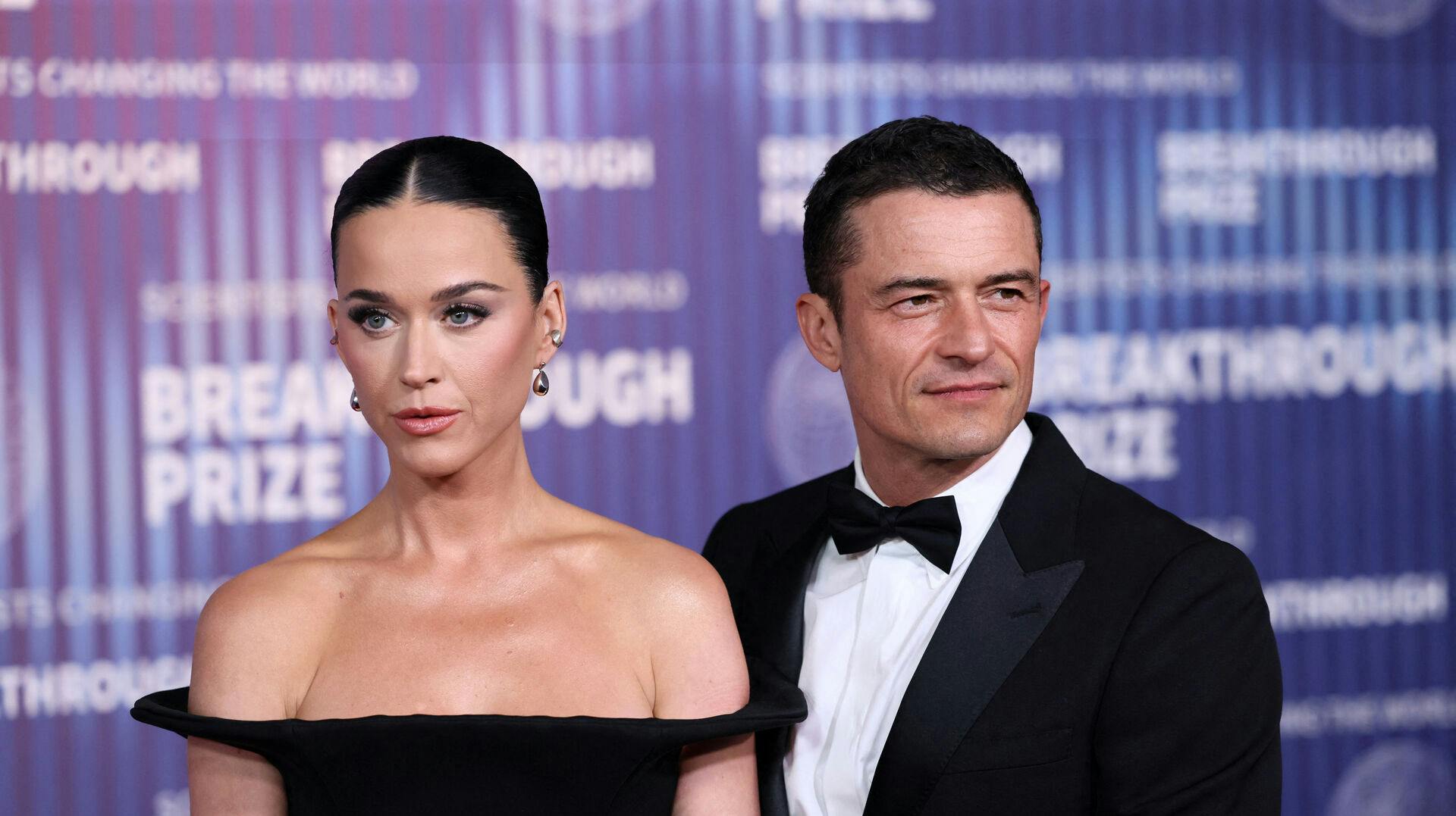 US singer Katy Perry (L) and English actor Orlando Bloom arrive at the Tenth Breakthrough Prize Ceremony at the Academy Museum of Motion Pictures in Los Angeles, California, on April 13, 2024.  Etienne Laurent / AFP