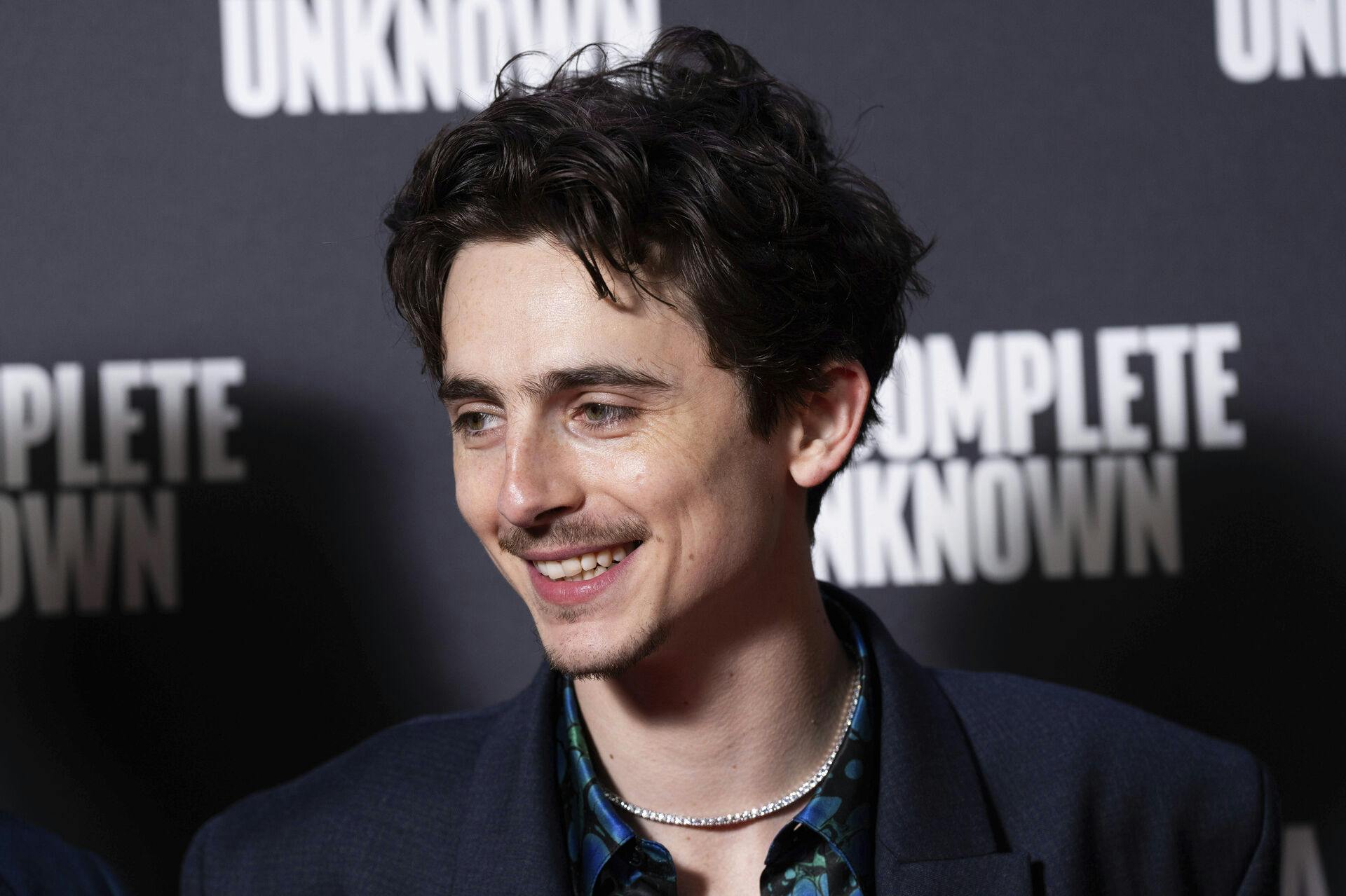 Timothee Chalamet poses for photographers upon arrival at the premiere of the film 'A Complete Unknown' in London, on Tuesday, Jan. 14, 2025. (Photo by Scott A Garfitt/Invision/AP)