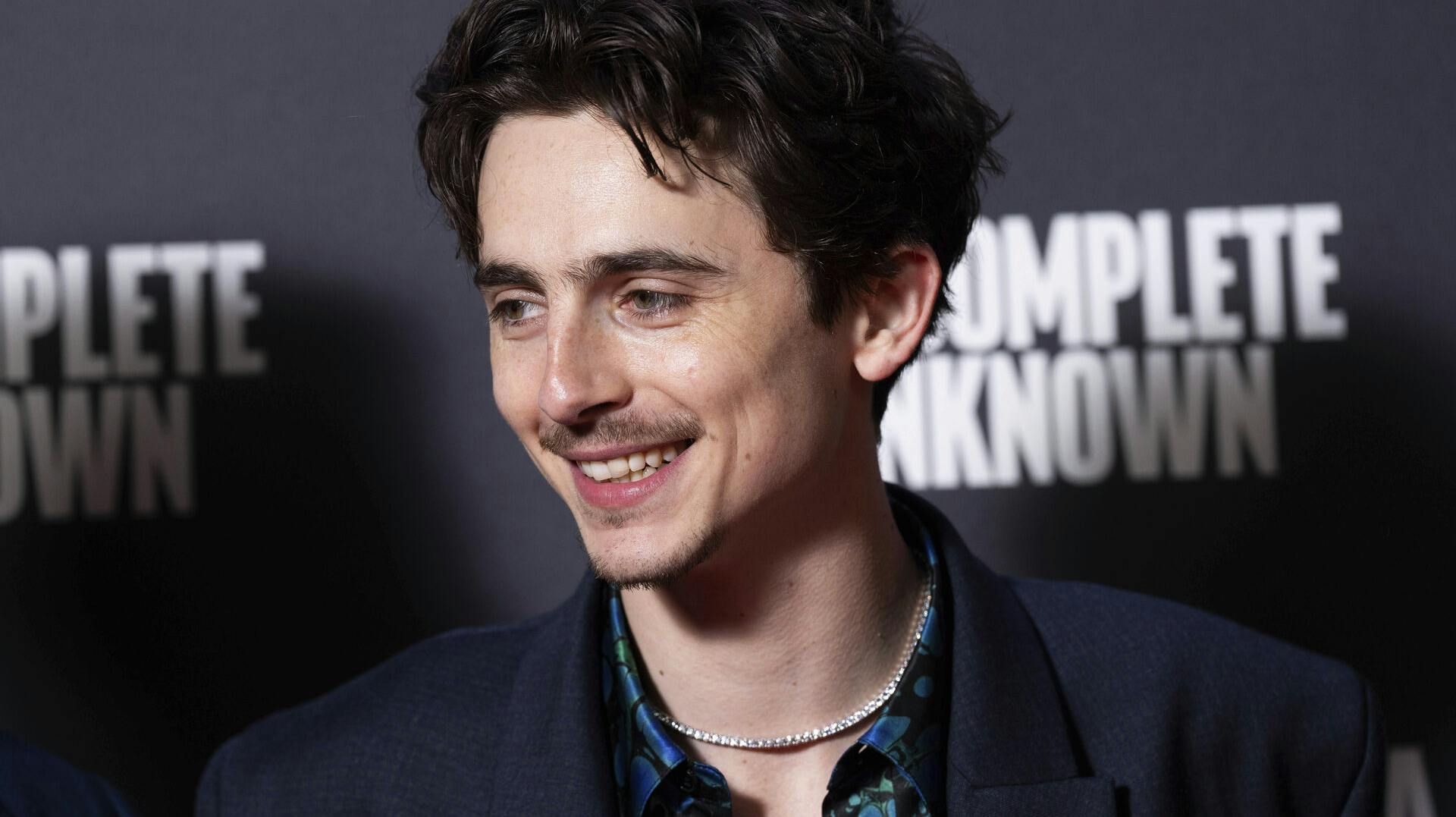 Timothee Chalamet poses for photographers upon arrival at the premiere of the film 'A Complete Unknown' in London, on Tuesday, Jan. 14, 2025. (Photo by Scott A Garfitt/Invision/AP)