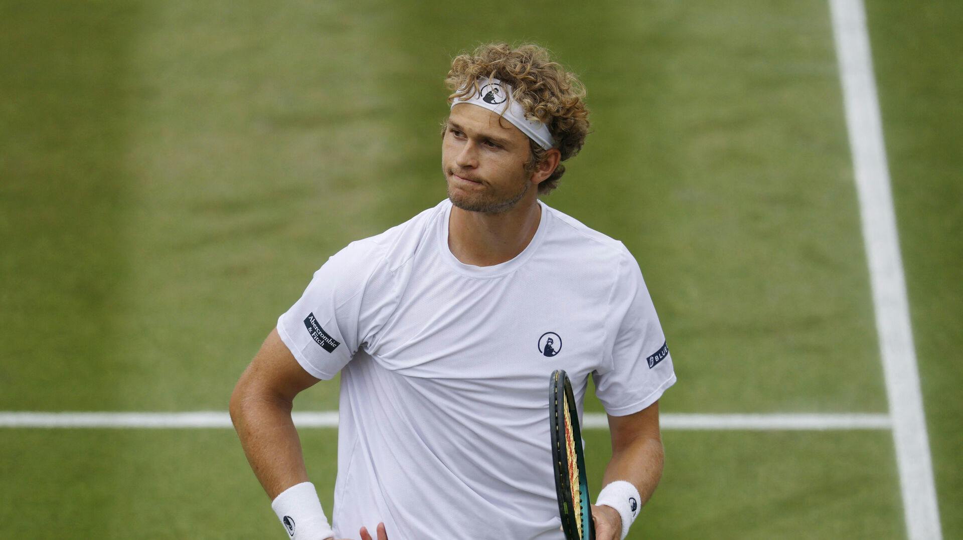 Tennis - Wimbledon - All England Lawn Tennis and Croquet Club, London, Britain - July 5, 2025 Denmark's August Holmgren reacts during his third round match against Australia's Alex De Minaur REUTERS/Andrew Couldridge