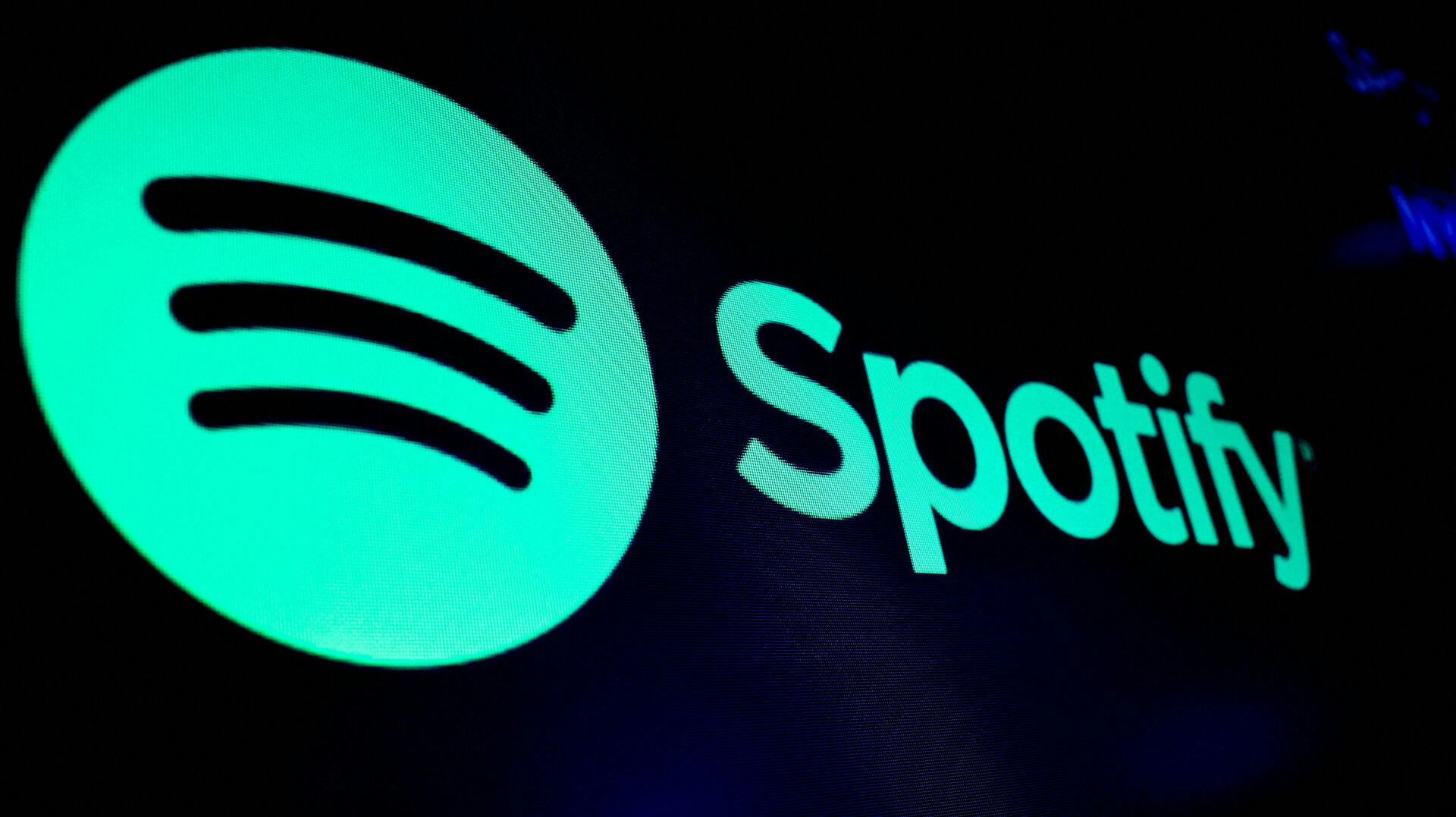 FILE PHOTO: A screen displays the logo of Spotify on the floor at the New York Stock Exchange (NYSE) in New York City, U.S., December 4, 2023. REUTERS/Brendan McDermid/File Photo