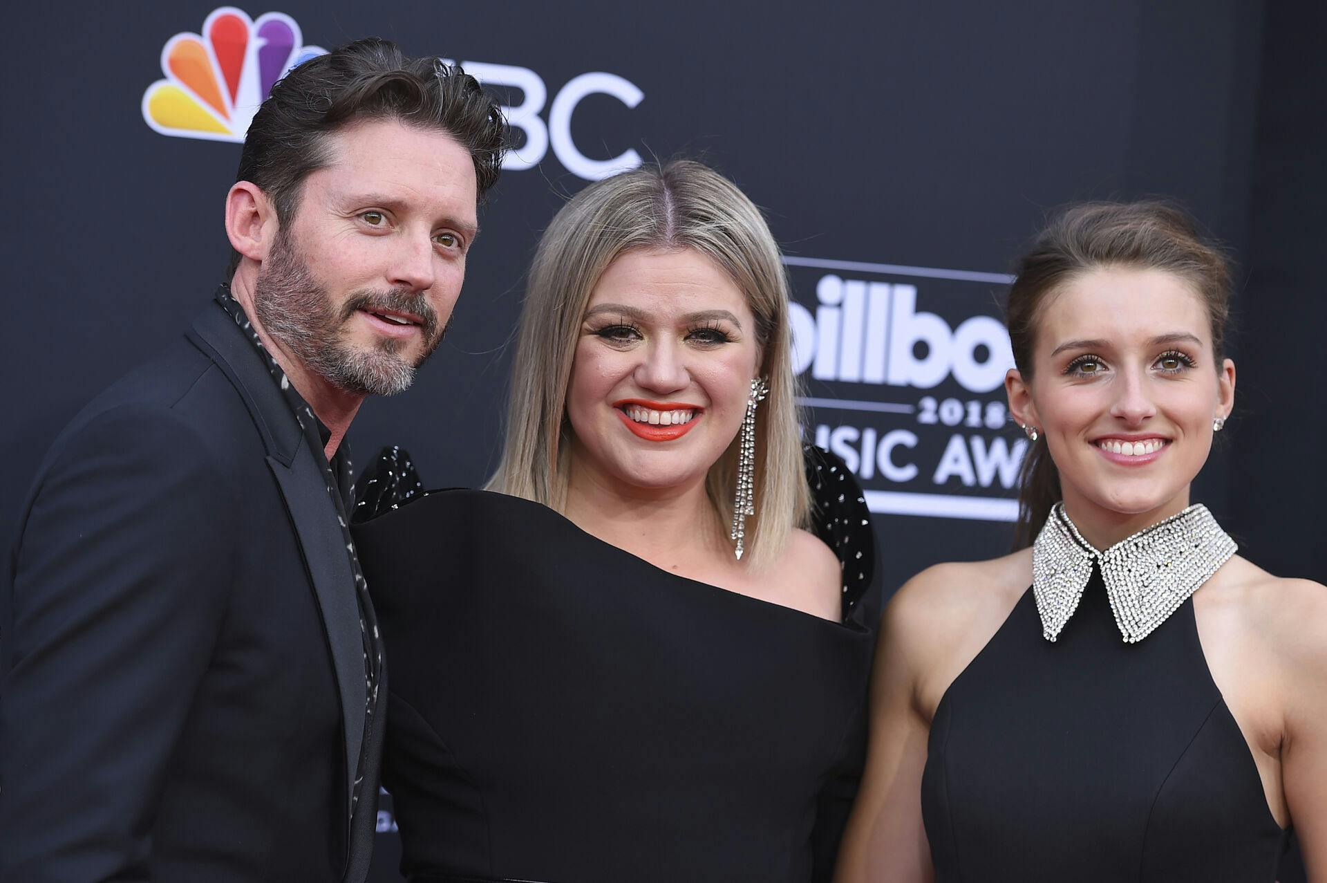Brandon Blackstock, from left, Kelly Clarkson and Savannah Blackstock arrive at the Billboard Music Awards at the MGM Grand Garden Arena on Sunday, May 20, 2018, in Las Vegas. (Photo by Jordan Strauss/Invision/AP)