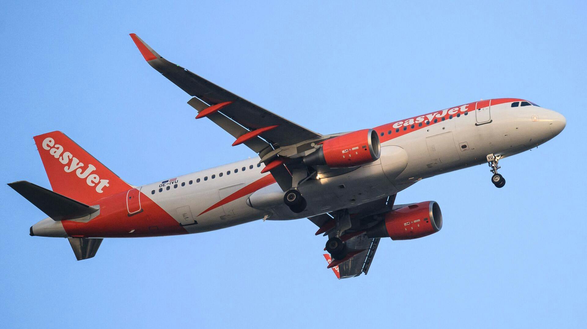 An EasyJet plane flies over the city of Nantes, western France, on April 23, 2025. (Photo by Loic VENANCE / AFP)