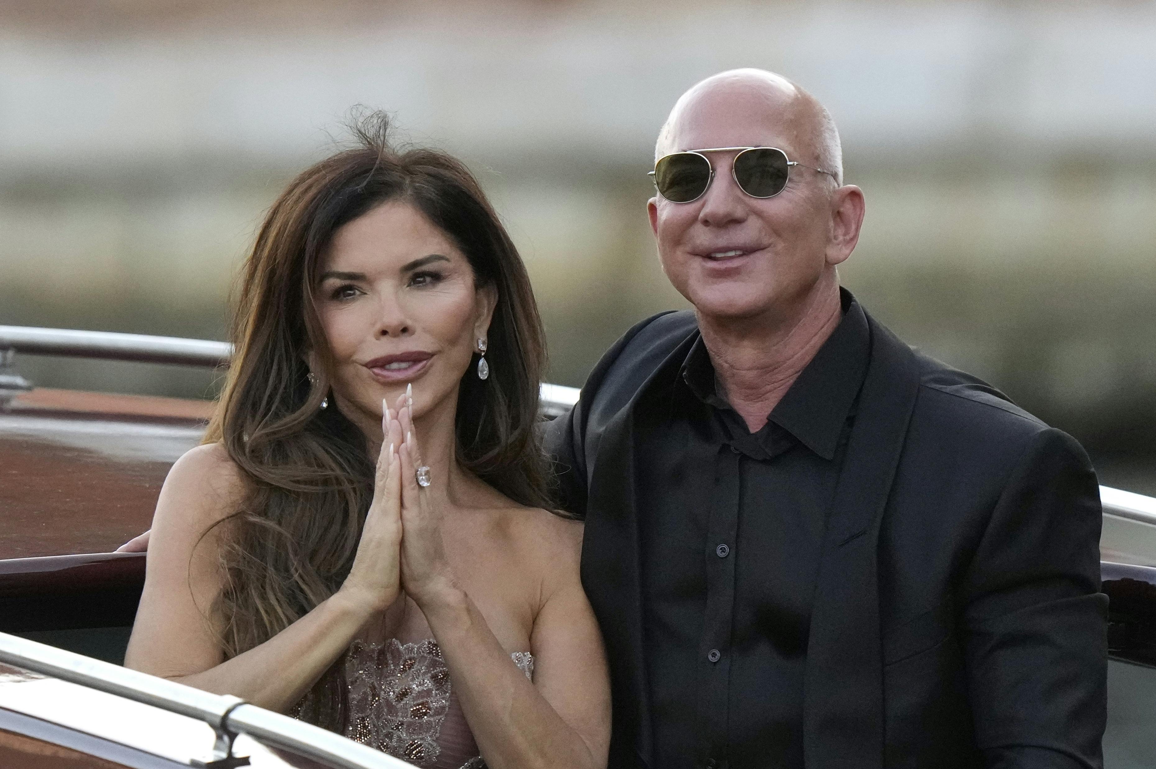 Lauren Sanchez Bezos, left, and Jeff Bezos depart from the Aman hotel during wedding celebrations in Venice, Italy, Saturday, June 28, 2025. (AP Photo/Luca Bruno)