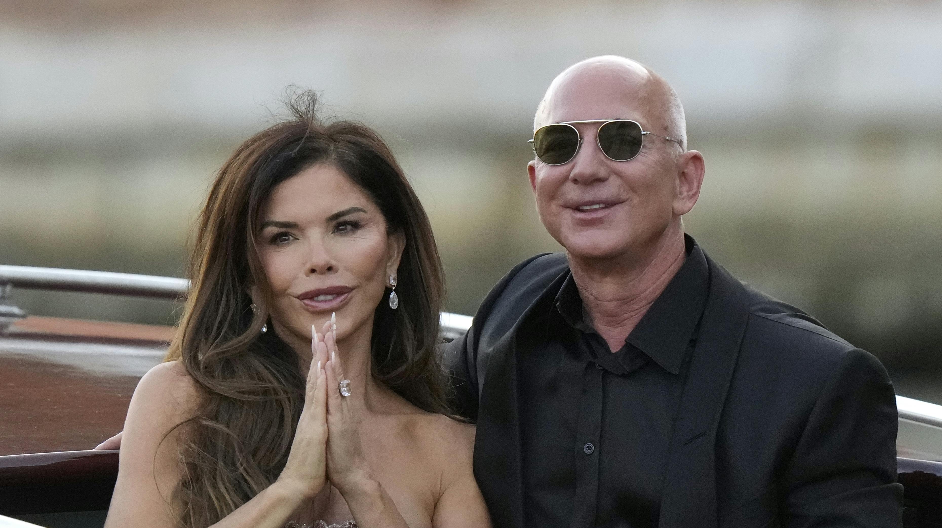 Lauren Sanchez Bezos, left, and Jeff Bezos depart from the Aman hotel during wedding celebrations in Venice, Italy, Saturday, June 28, 2025. (AP Photo/Luca Bruno)