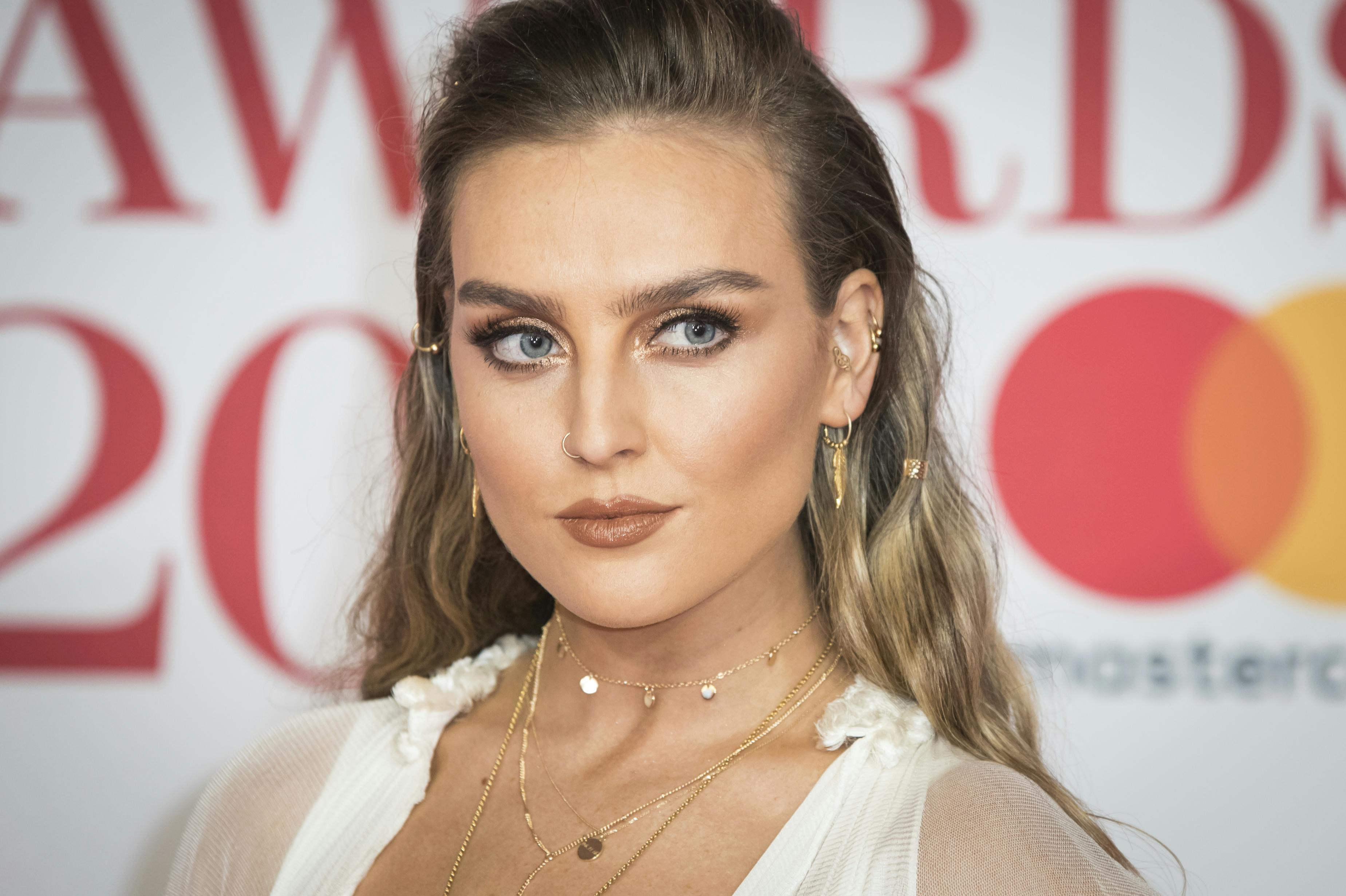 Perrie Edwards of Little Mix poses for photographers upon arrival at the Brit Awards 2018 in London, Wednesday, Feb. 21, 2018. (Photo by Vianney Le Caer/Invision/AP)