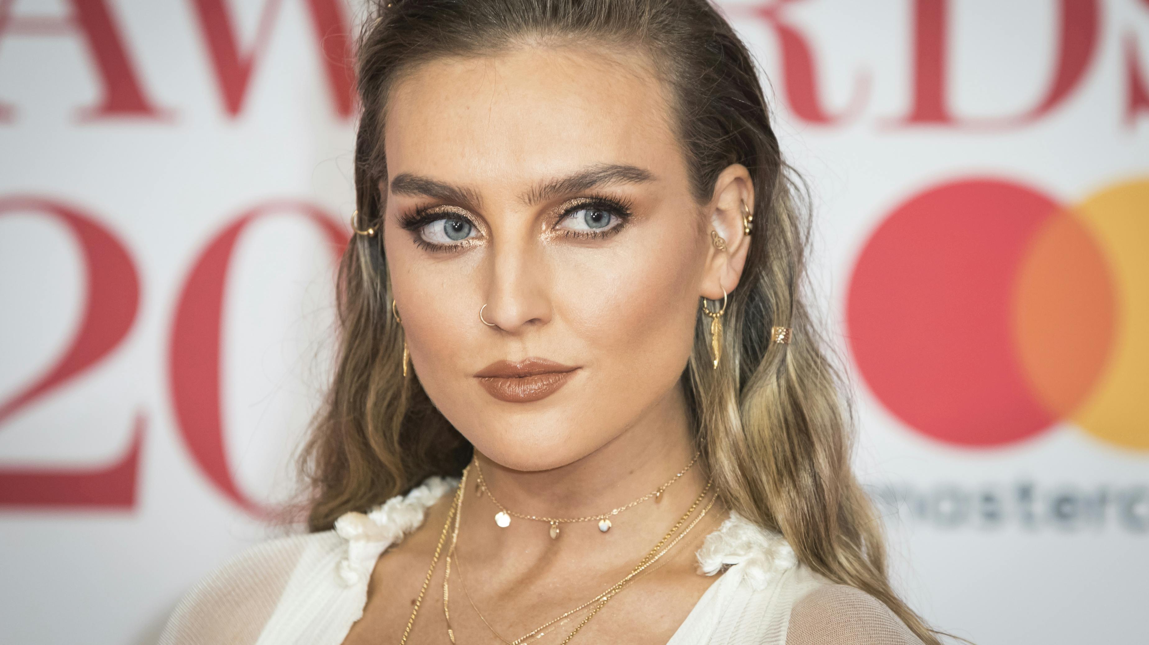 Perrie Edwards of Little Mix poses for photographers upon arrival at the Brit Awards 2018 in London, Wednesday, Feb. 21, 2018. (Photo by Vianney Le Caer/Invision/AP)