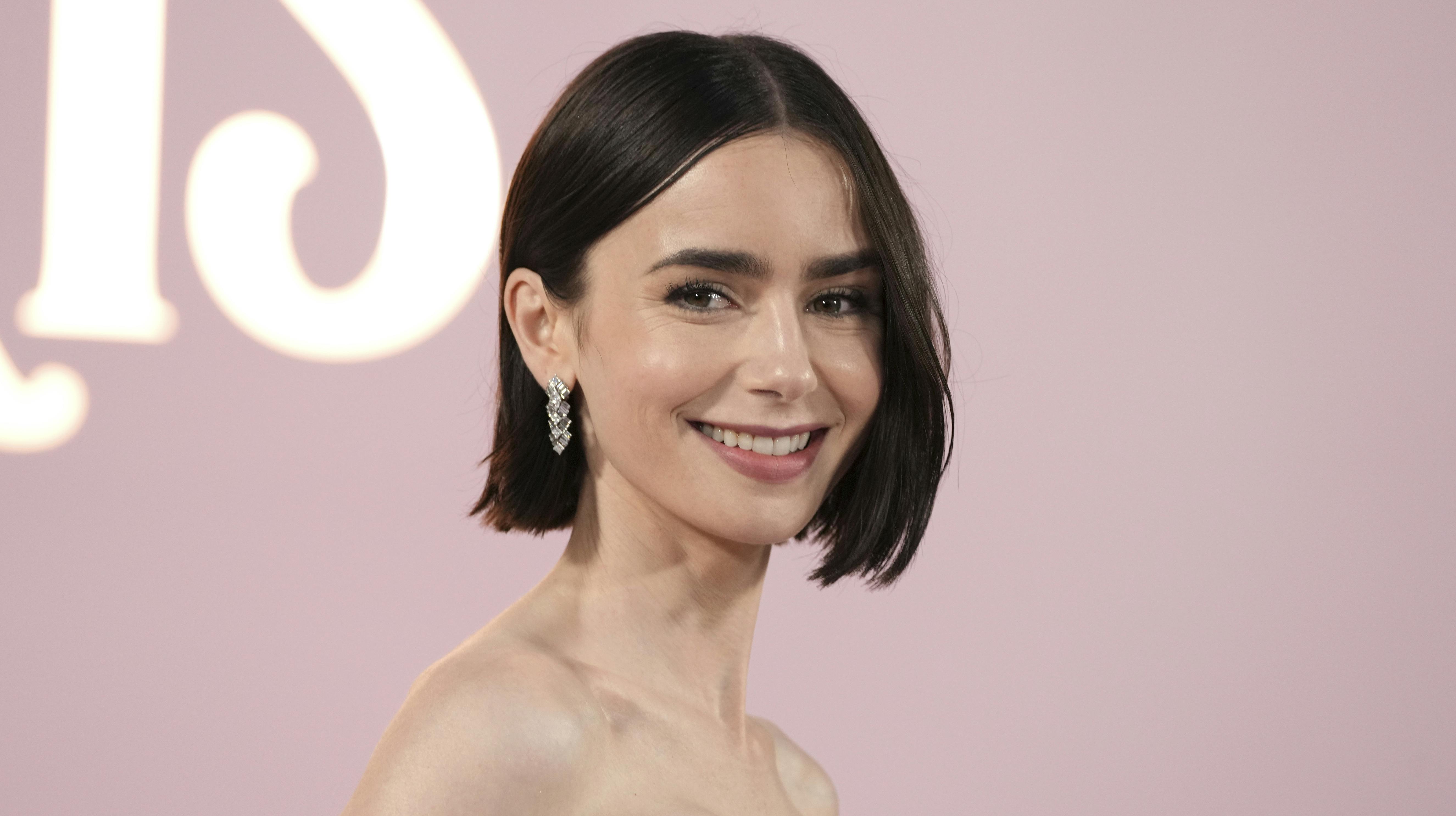 Lily Collins arrives at the premiere of "Emily in Paris" at the Egyptian Theatre, Wednesday, Aug. 14, 2024, in Los Angeles. (Photo by Jordan Strauss/Invision/AP)