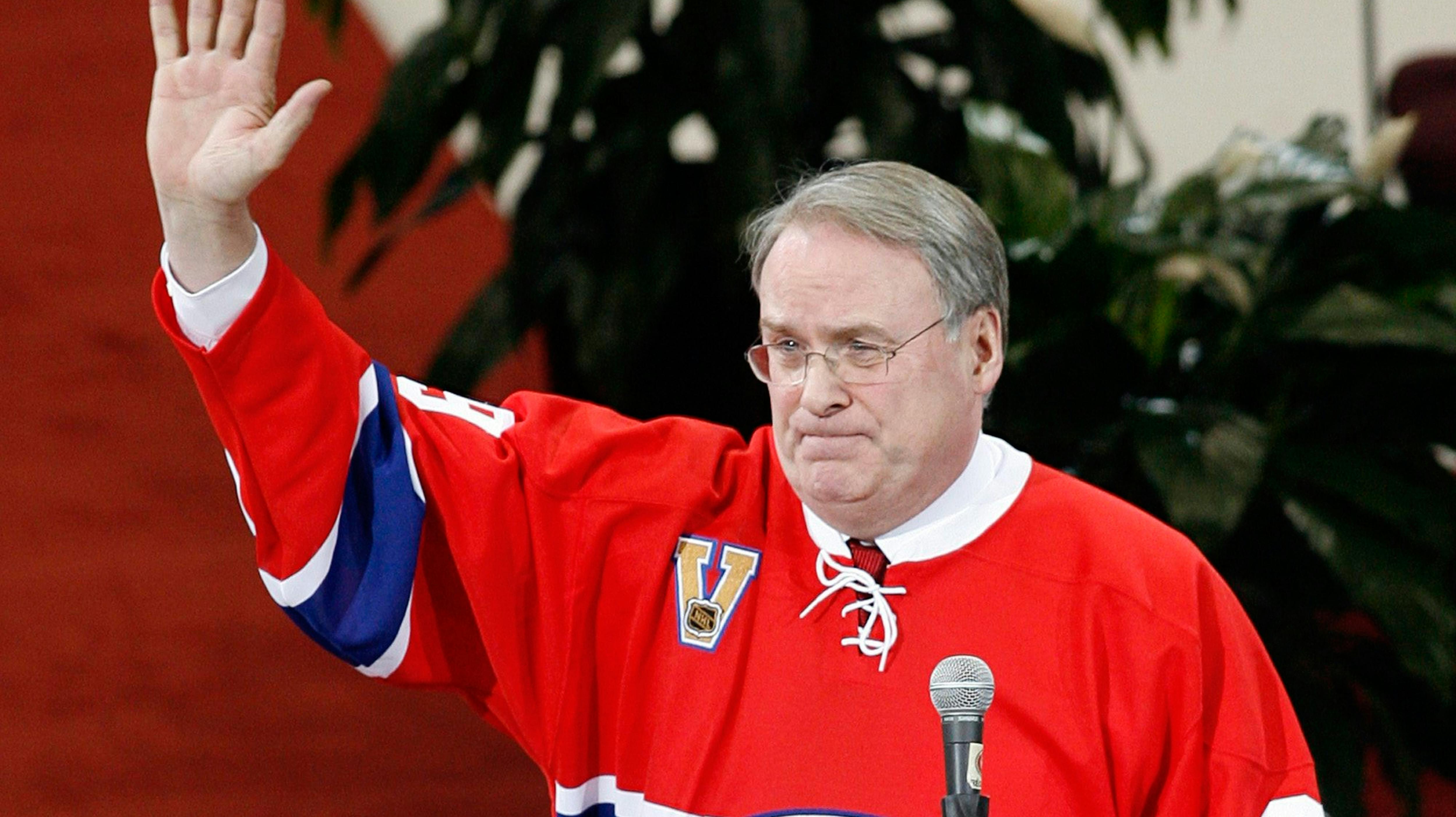 FILE - Former Montreal Canadiens goaltender Ken Dryden waves to the crowd at the Bell Centre as his number is retired during a pre-game ceremony, on Jan. 29, 2007 in Montreal. (Ryan Remiorz/The Canadian Press via AP, File)