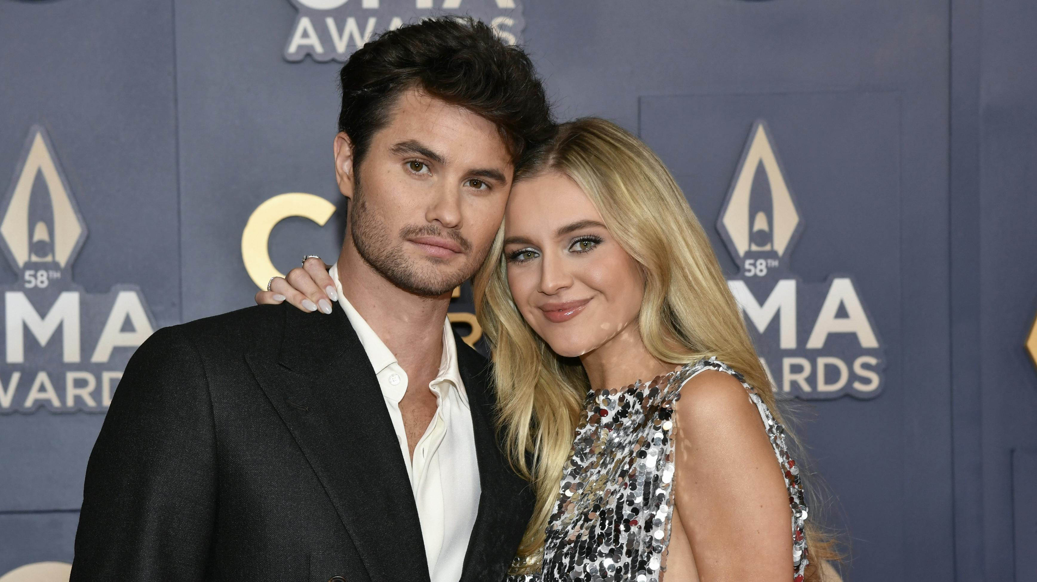 Chase Stokes, left, and Kelsea Ballerini arrive at the 58th Annual CMA Awards on Wednesday, Nov. 20, 2024, at Bridgestone Arena in Nashville, Tenn. (Photo by Evan Agostini/Invision/AP)