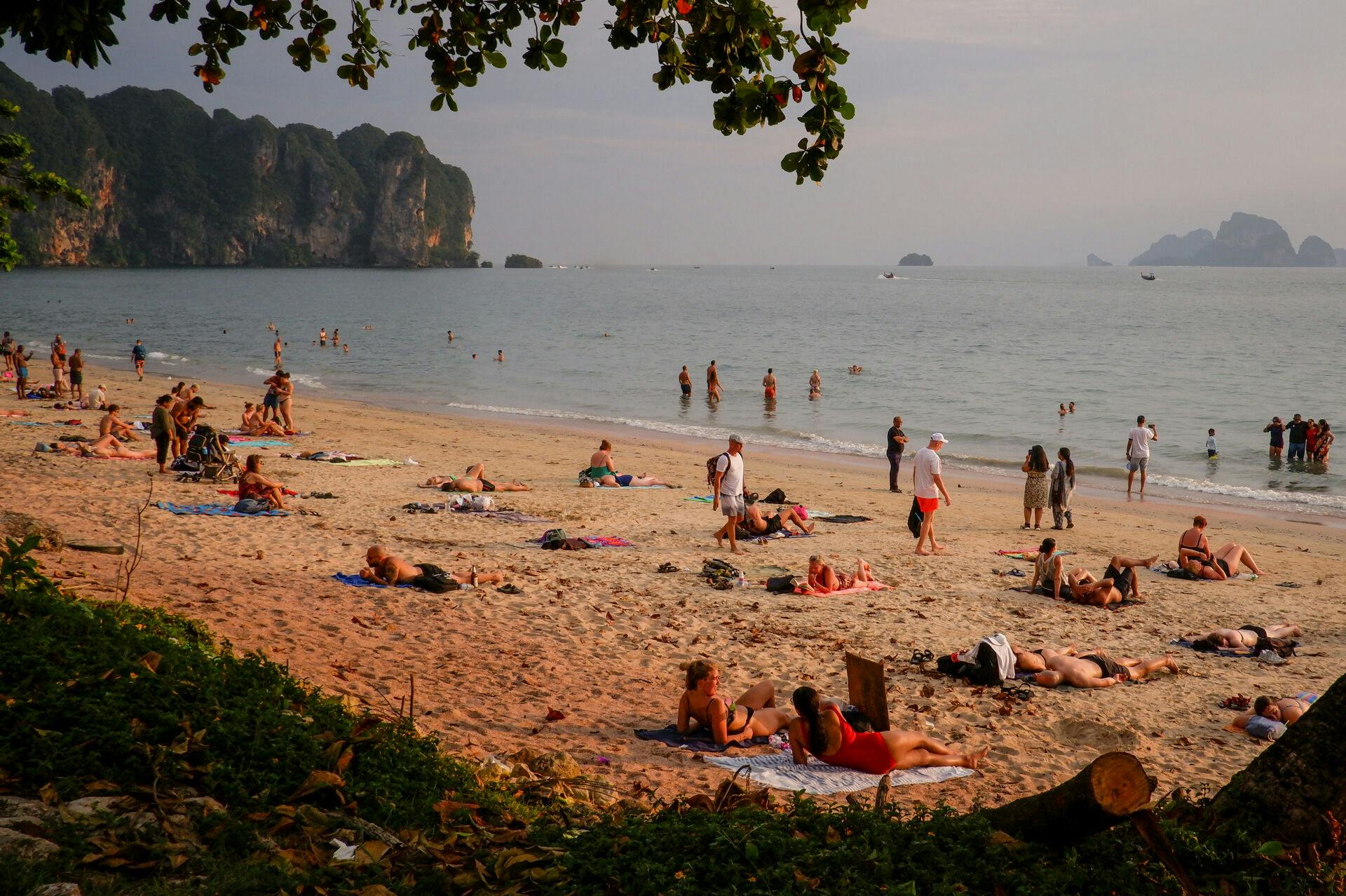 This picture taken on November 21, 2023 shows tourists relaxing on Krabi's Ao Nang beach. Candida NG / AFP