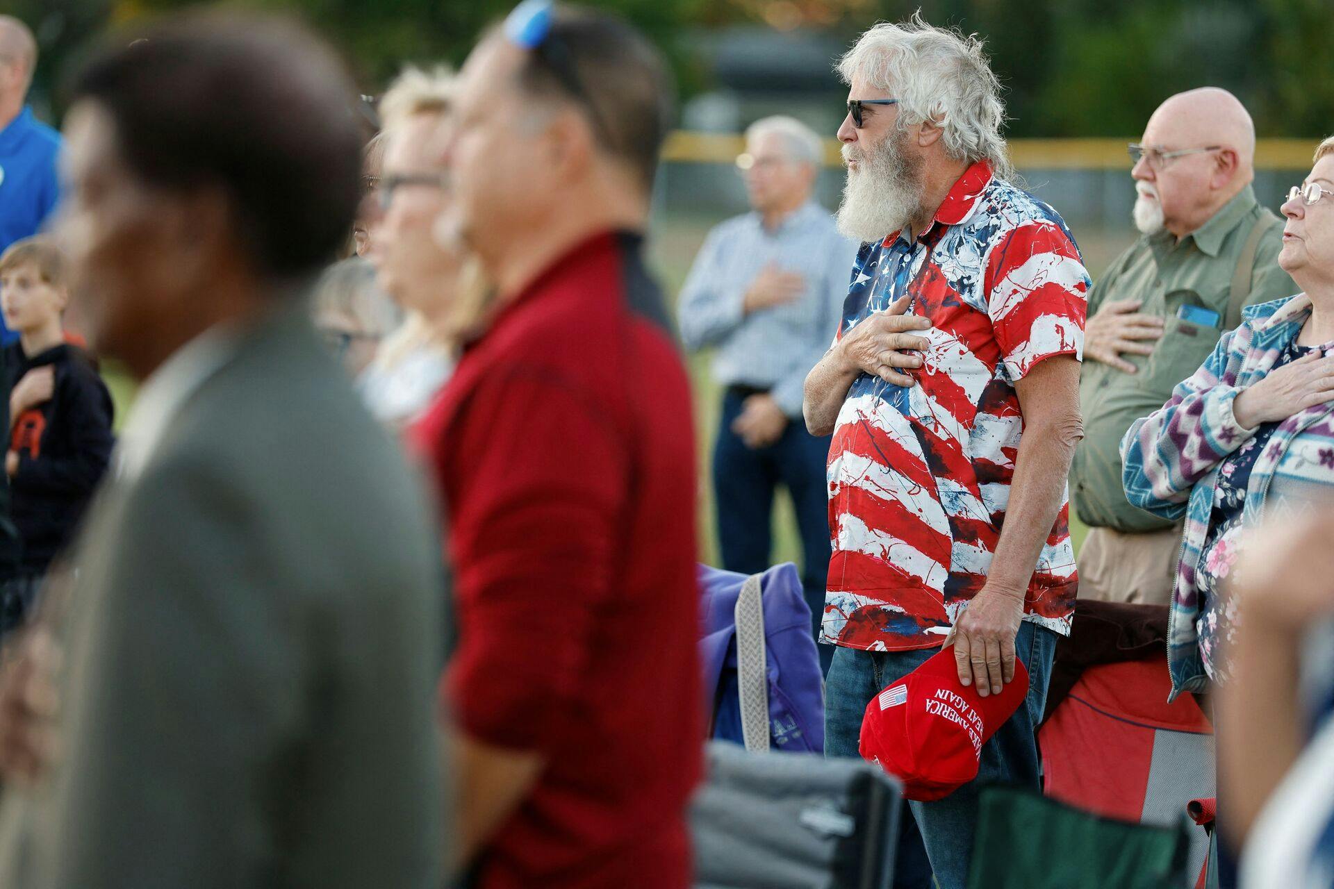 People attend a prayer vigil led by Pasto