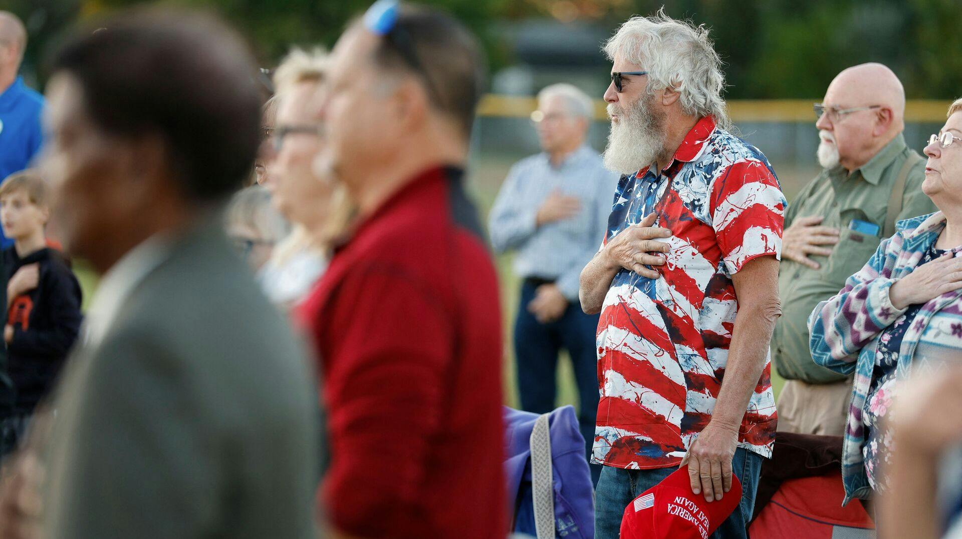 People attend a prayer vigil led by Pasto