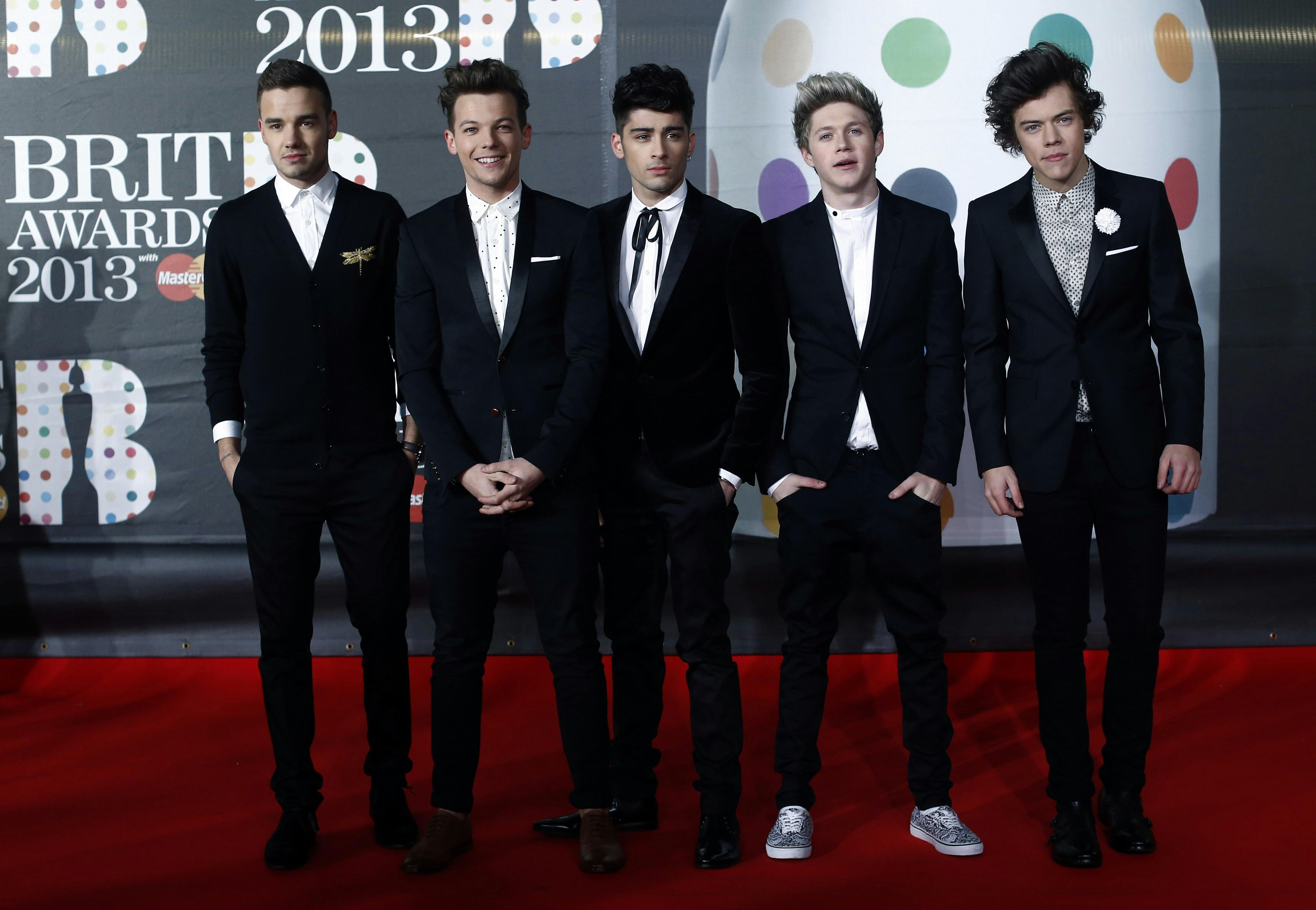 (FILES) In a file picture taken on February 20, 2013 (L-R) Liam Payne, Louis Tomlinson, Zayn Malik, Niall Horan and Harry Styles of British-Irish pop band 'One Direction' pose on the red carpet arriving at the BRIT Awards 2013 in London. Zayn Malik has left British boy band One Direction but it will continue without him, the group said March 25, 2015. AFP PHOTO / ANDREW COWIE
