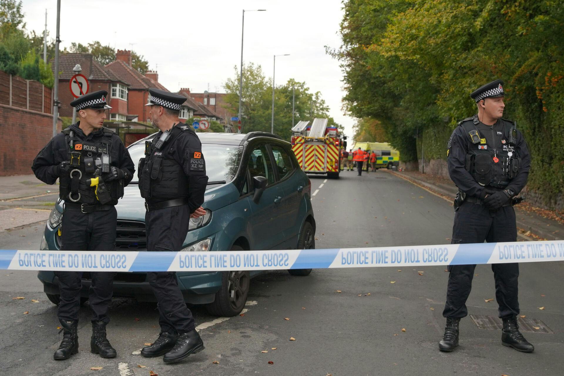 Police stand guard near the scene of a stabbing incident at Heaton Park Hebrew Congregation synagogue, in Crumpsall, Manchester, England, Thursday, Oct. 2, 2025. (AP Photo/Ian Hodgson)
