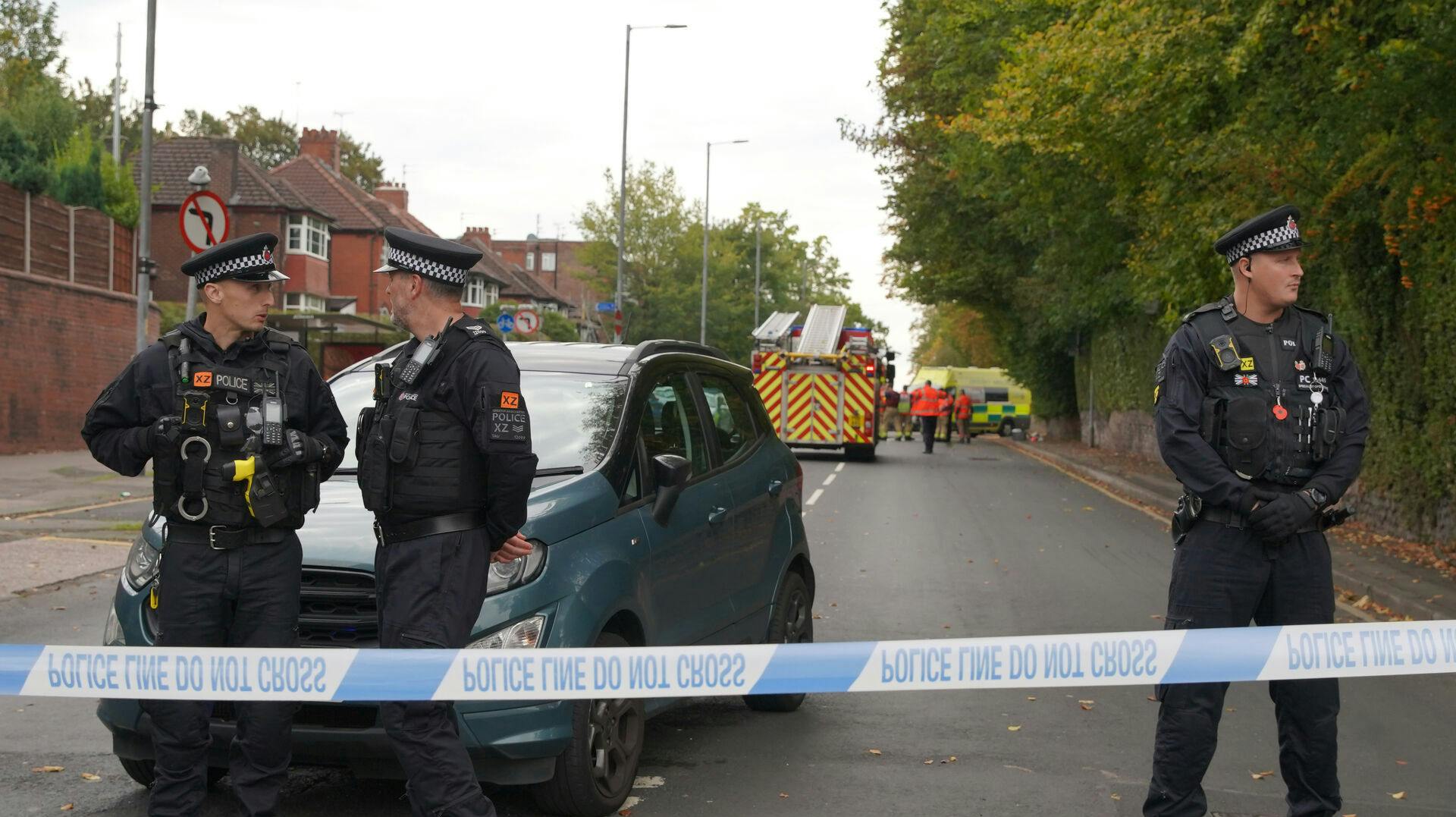 Police stand guard near the scene of a stabbing incident at Heaton Park Hebrew Congregation synagogue, in Crumpsall, Manchester, England, Thursday, Oct. 2, 2025. (AP Photo/Ian Hodgson)