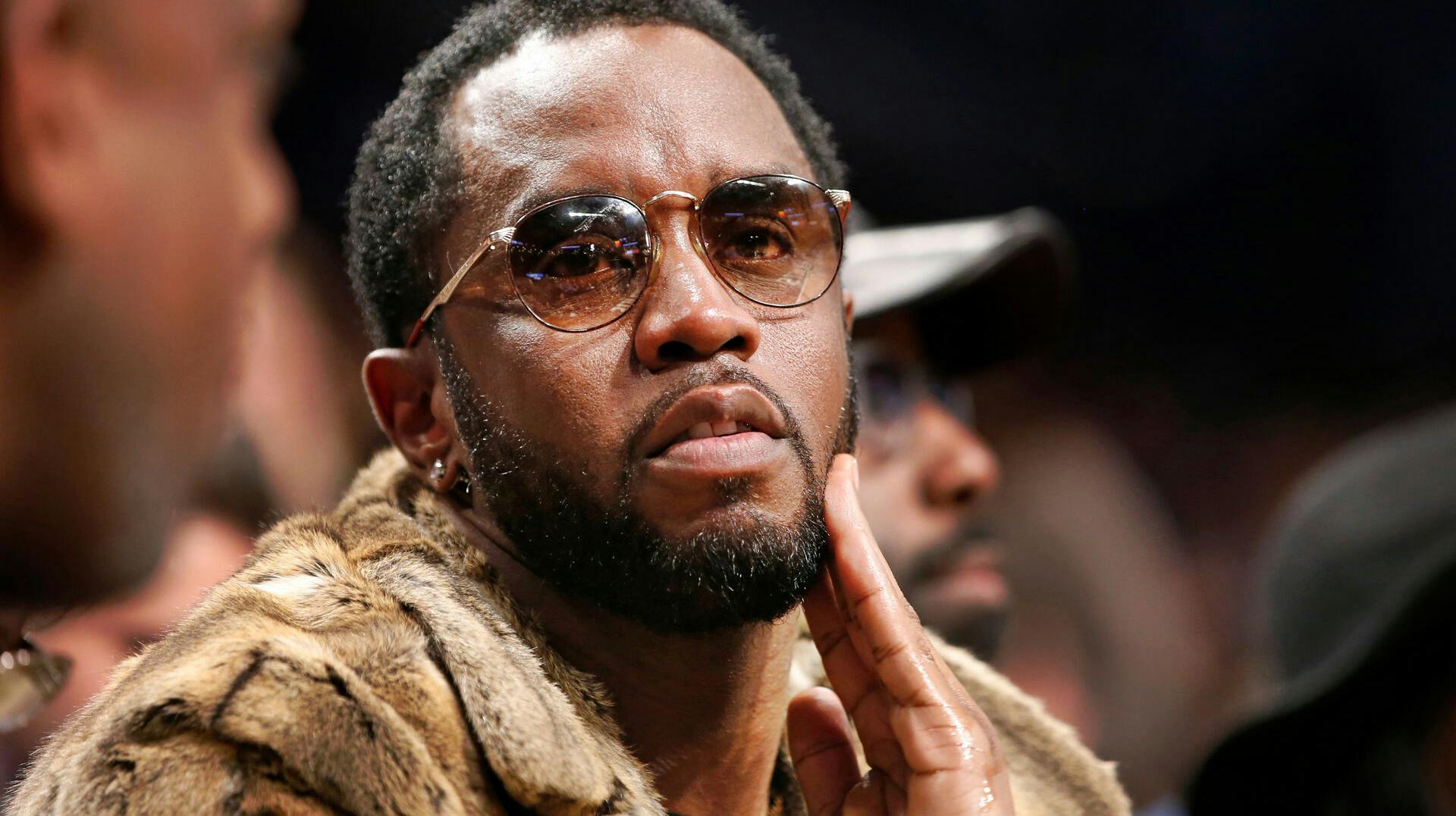 FILE - Sean "Diddy" Combs sits courtside in the second half of an NBA basketball game between the Brooklyn Nets and the New York Knicks, March 12, 2017, in New York. (AP Photo/Kathy Willens, File)