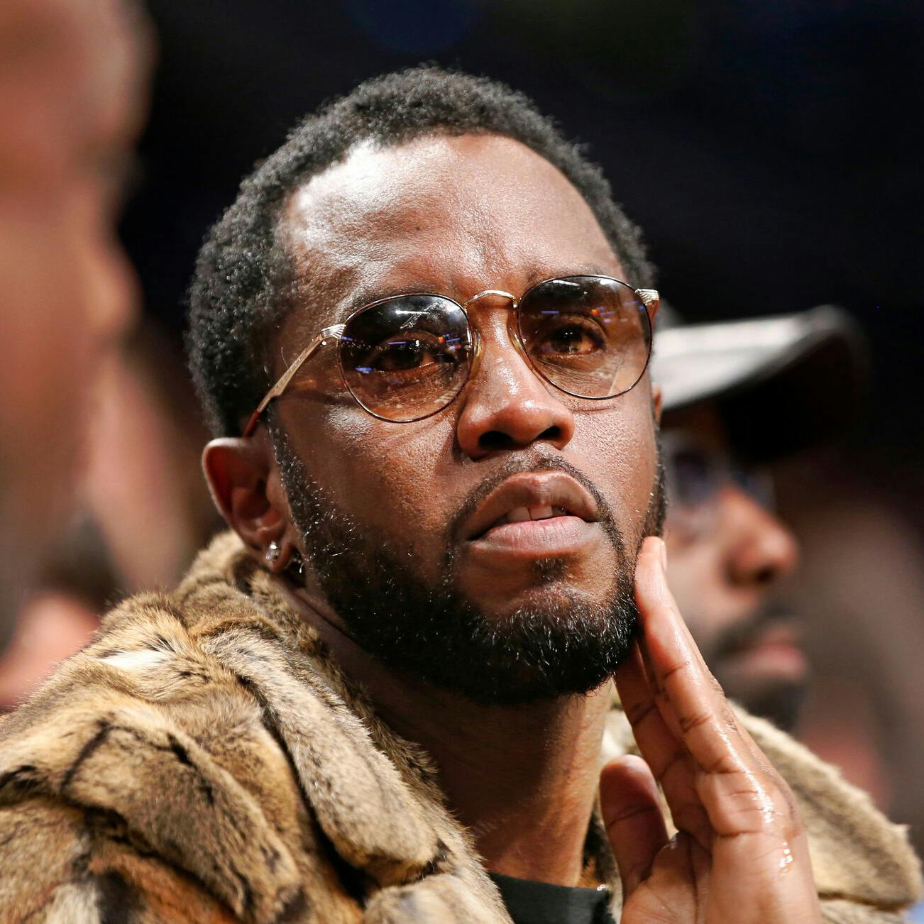 FILE - Sean "Diddy" Combs sits courtside in the second half of an NBA basketball game between the Brooklyn Nets and the New York Knicks, March 12, 2017, in New York. (AP Photo/Kathy Willens, File)