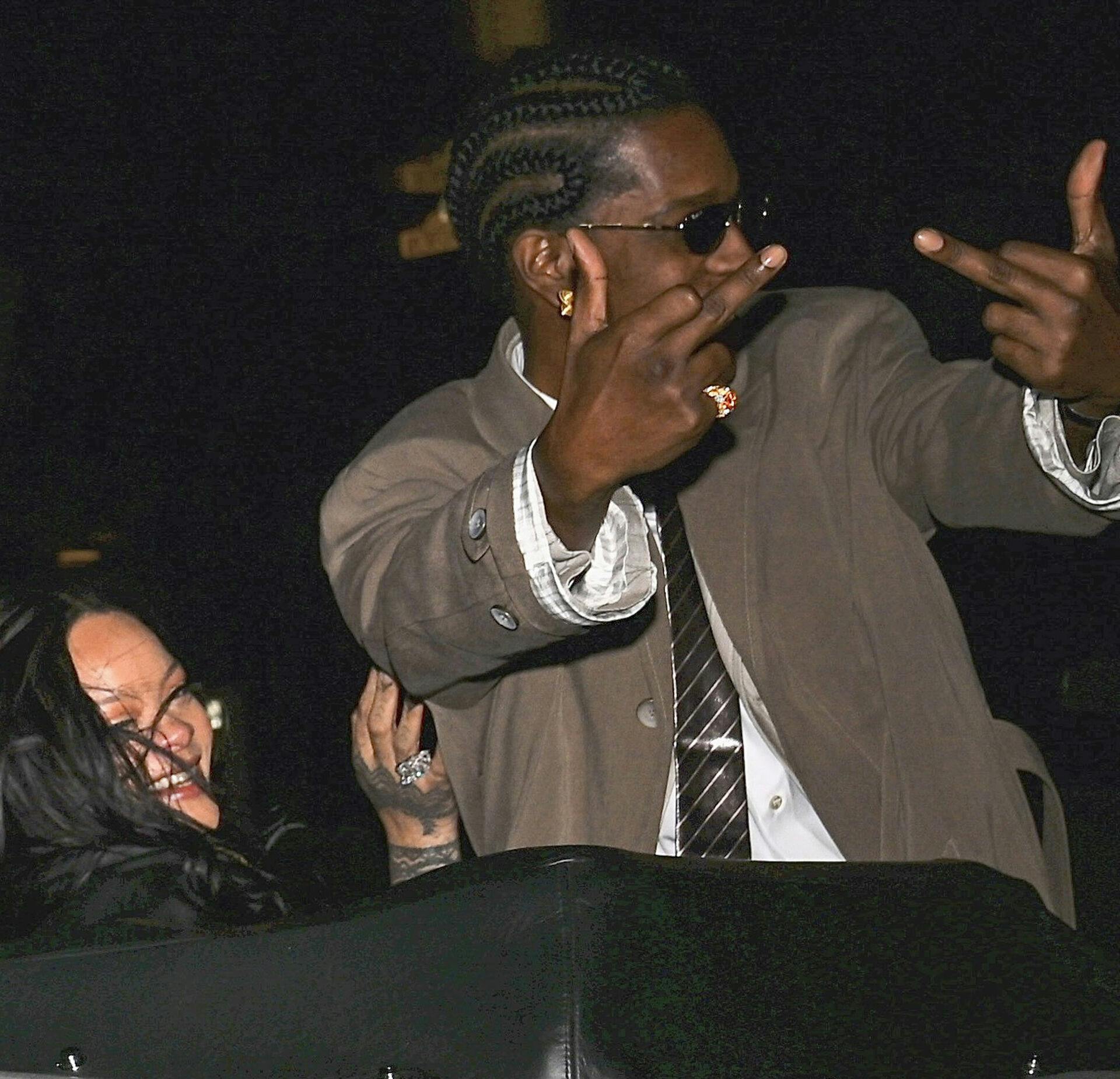 ASAP Rocky stepped out in style for his birthday celebration with Rihanna, cruising in a drop top Rolls Royce. He wore a beige trench coat over an oversized beige suit with a crisp white dress shirt and a glossy striped tie. His look was completed with black sunglasses, gold earrings, and neatly braided hair. Pictured: asap rocky, rihanna Ref: BLU_S8567137 041025 NON-EXCLUSIVE Picture by: Sil / SplashNews.com Splash News and Pictures USA: 310-525-5808 UK: 020 8126 1009 eamteam@shutterstock.com World Rights