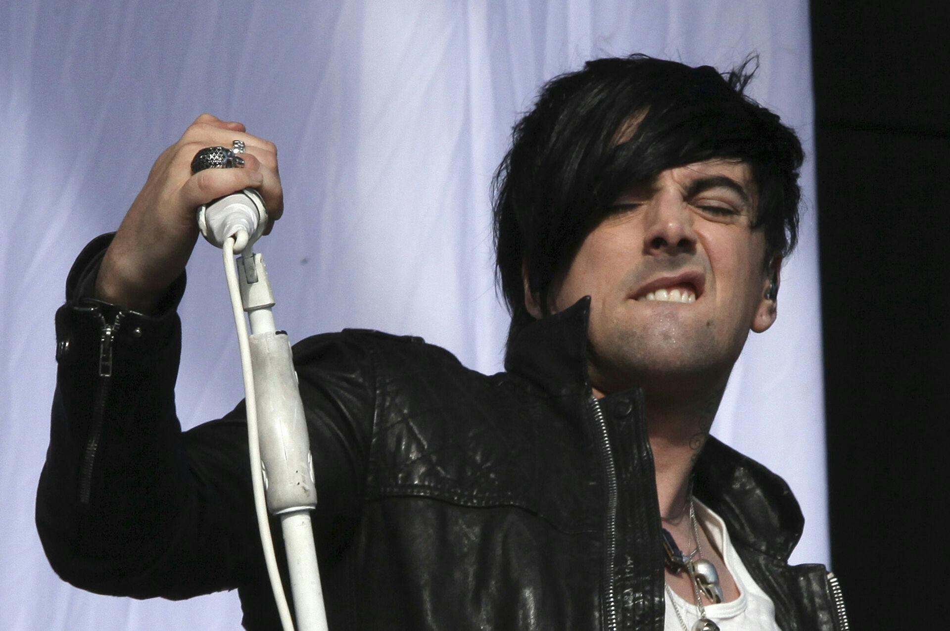 Ian Watkins ses på scenen under en britisk festival i 2011, kort tid før hans grusomme forbrydelser blev afsløret.