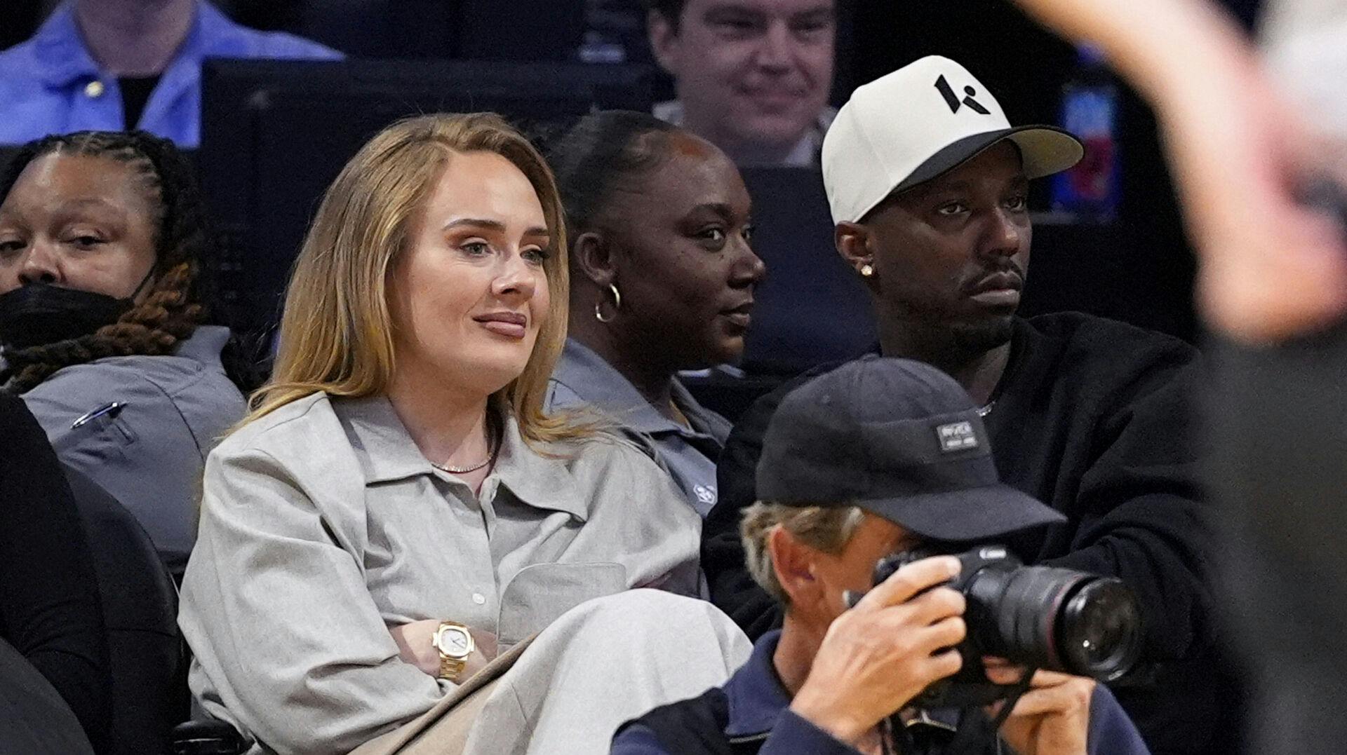 Singer Adele, left, and sports agent Rich Paul watch during the second half in Game 1 of an NBA first-round playoff series between the Los Angeles Lakers and the Minnesota Timberwolves, Saturday, April 19, 2025, in Los Angeles. (AP Photo/Mark J. Terrill)
