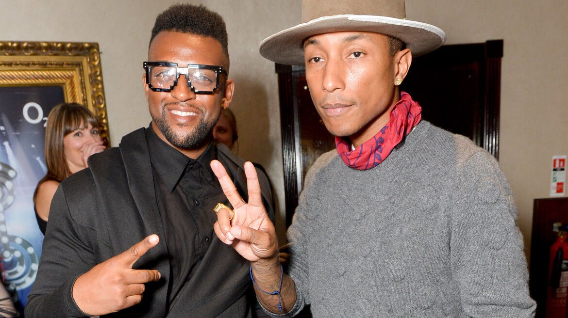 Oritse Williams and Pharrell Williams attend the Nordoff Robbins O2 Silver Clef Awards 2014 at the Hilton Hotel in London on Friday, July 4, 2014. (Photo by Jon Furniss/Invision/AP)