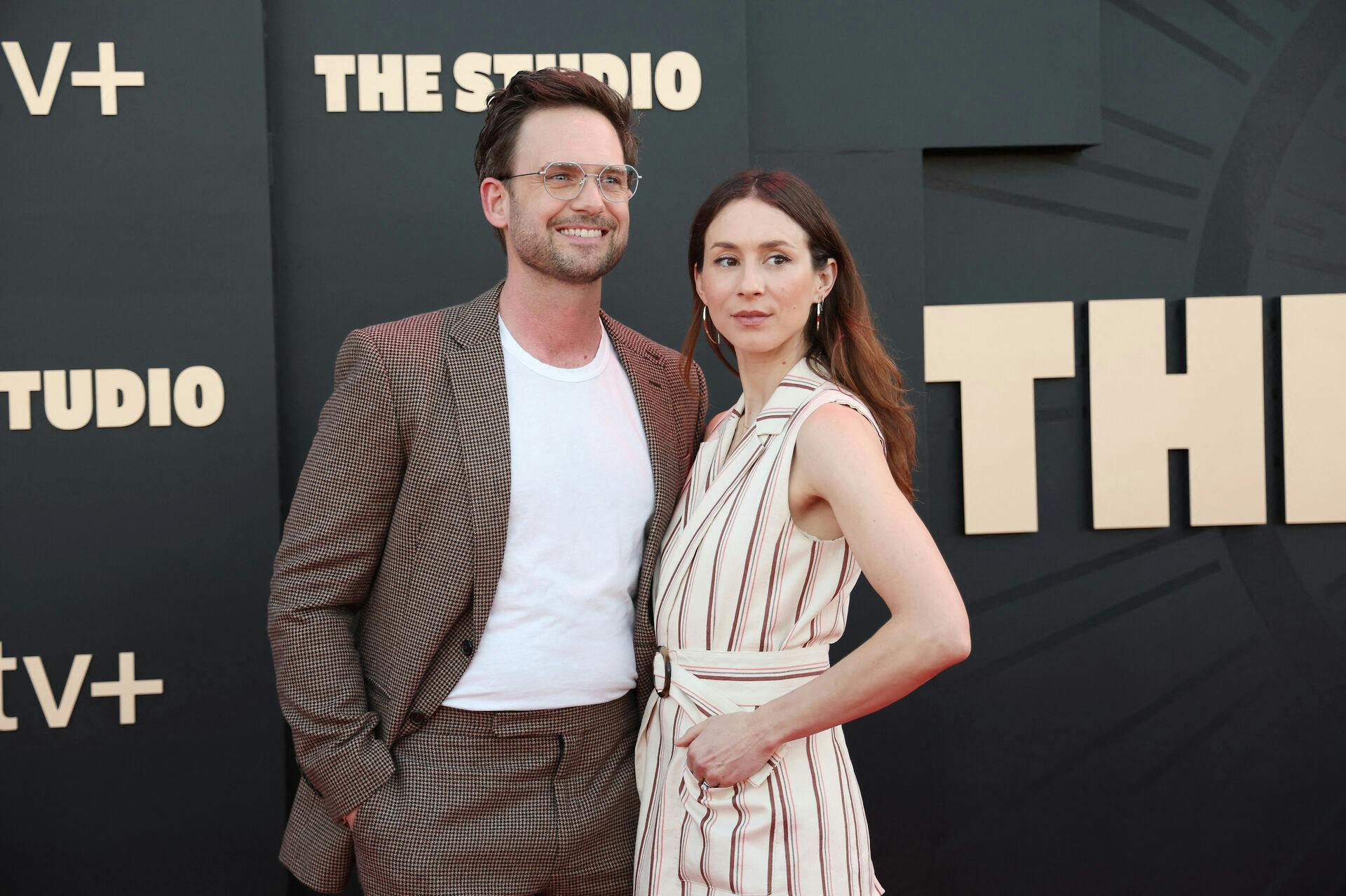 US actress Troian Bellisario (R) and husband Canadian-US actor Patrick J. Adams attend the Apple TV+ series premiere of "The Studio" at the Academy Museum in Los Angeles, March 24, 2025. Michael Tran / AFP
