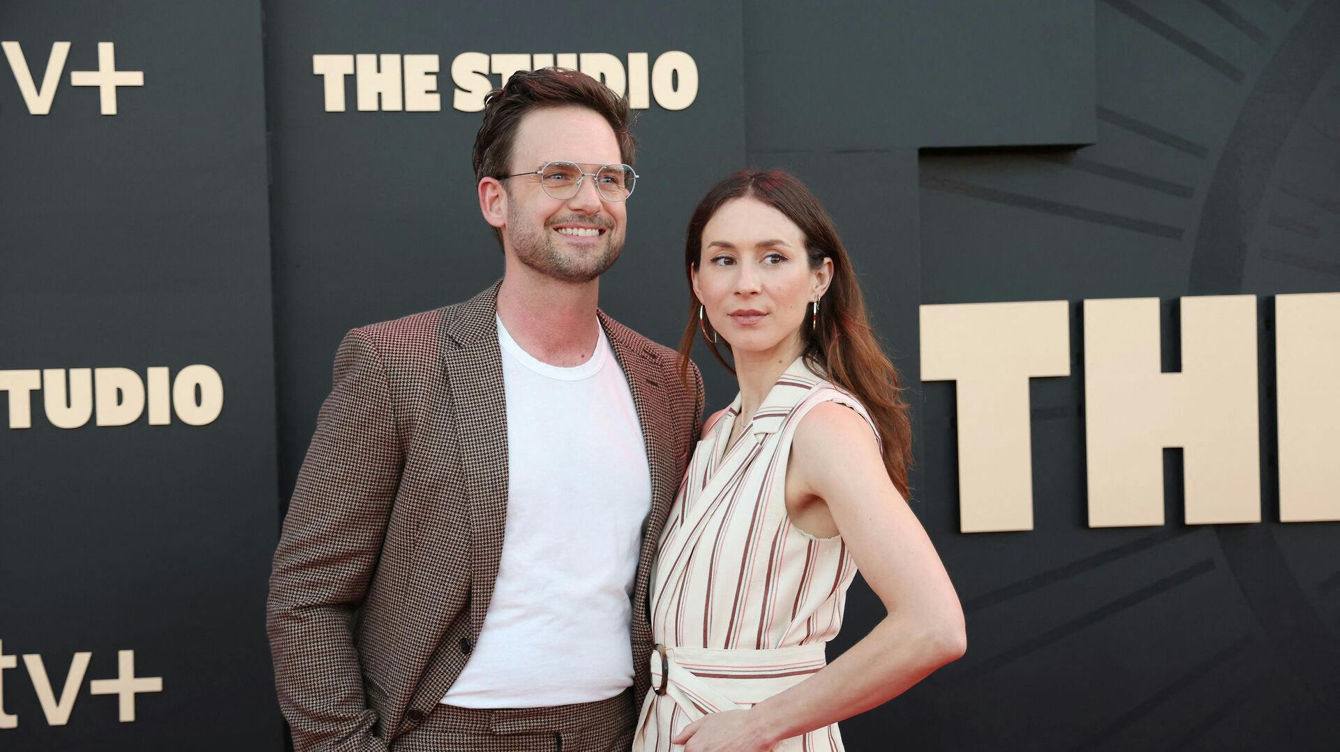 US actress Troian Bellisario (R) and husband Canadian-US actor Patrick J. Adams attend the Apple TV+ series premiere of "The Studio" at the Academy Museum in Los Angeles, March 24, 2025. Michael Tran / AFP