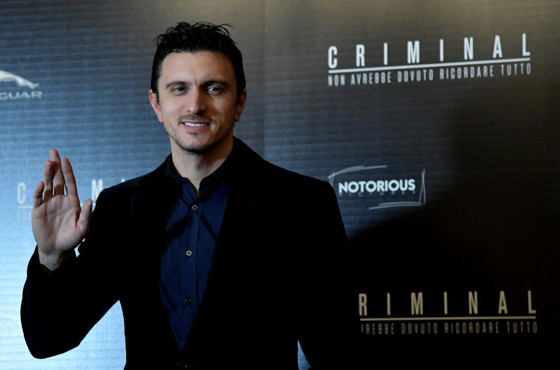 Actor Emil Dragos Savulescu poses during the photocall of the film "Criminal" in Rome on April 8, 2016.  . TIZIANA FABI / AFP