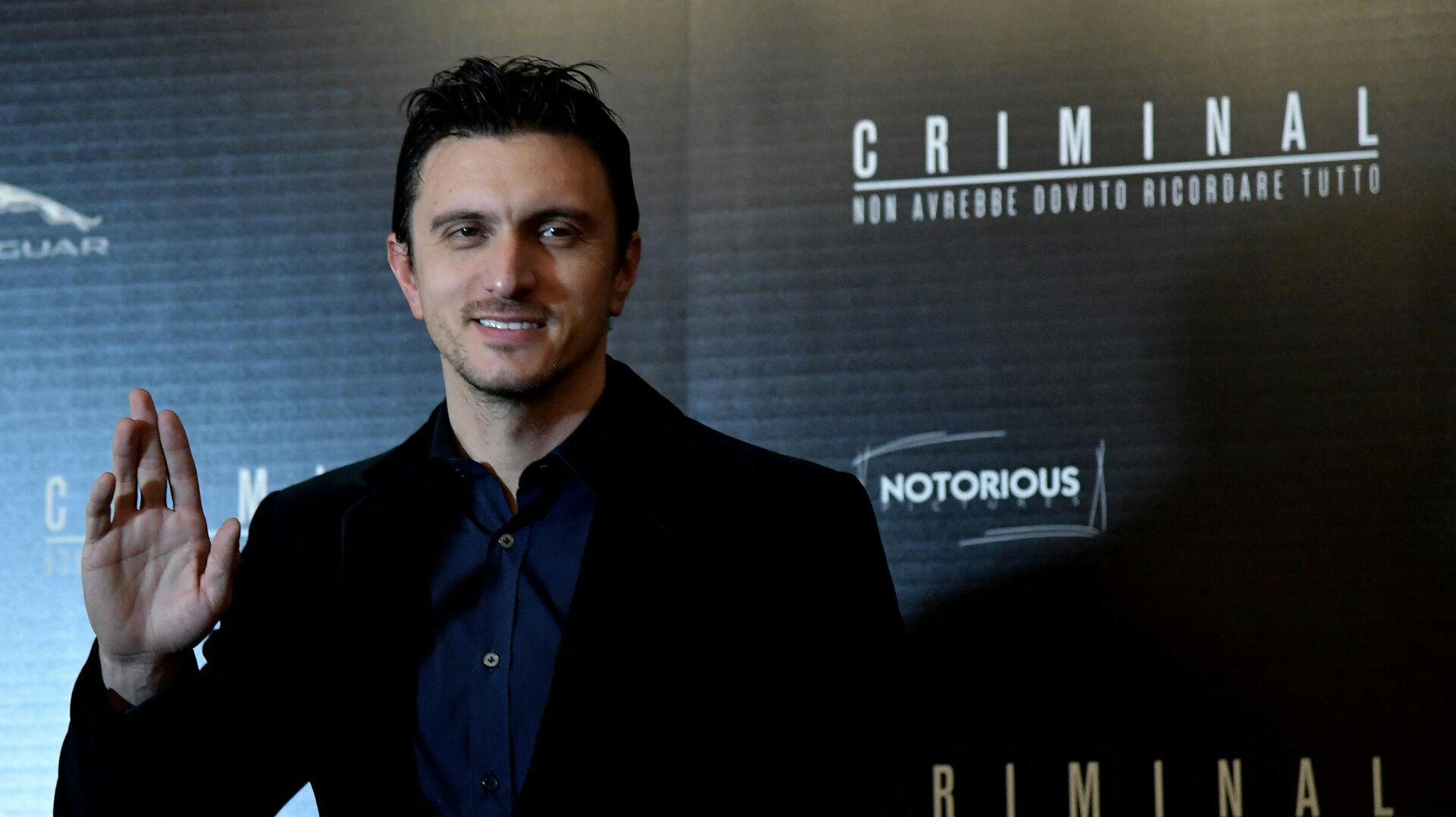 Actor Emil Dragos Savulescu poses during the photocall of the film "Criminal" in Rome on April 8, 2016.  . TIZIANA FABI / AFP