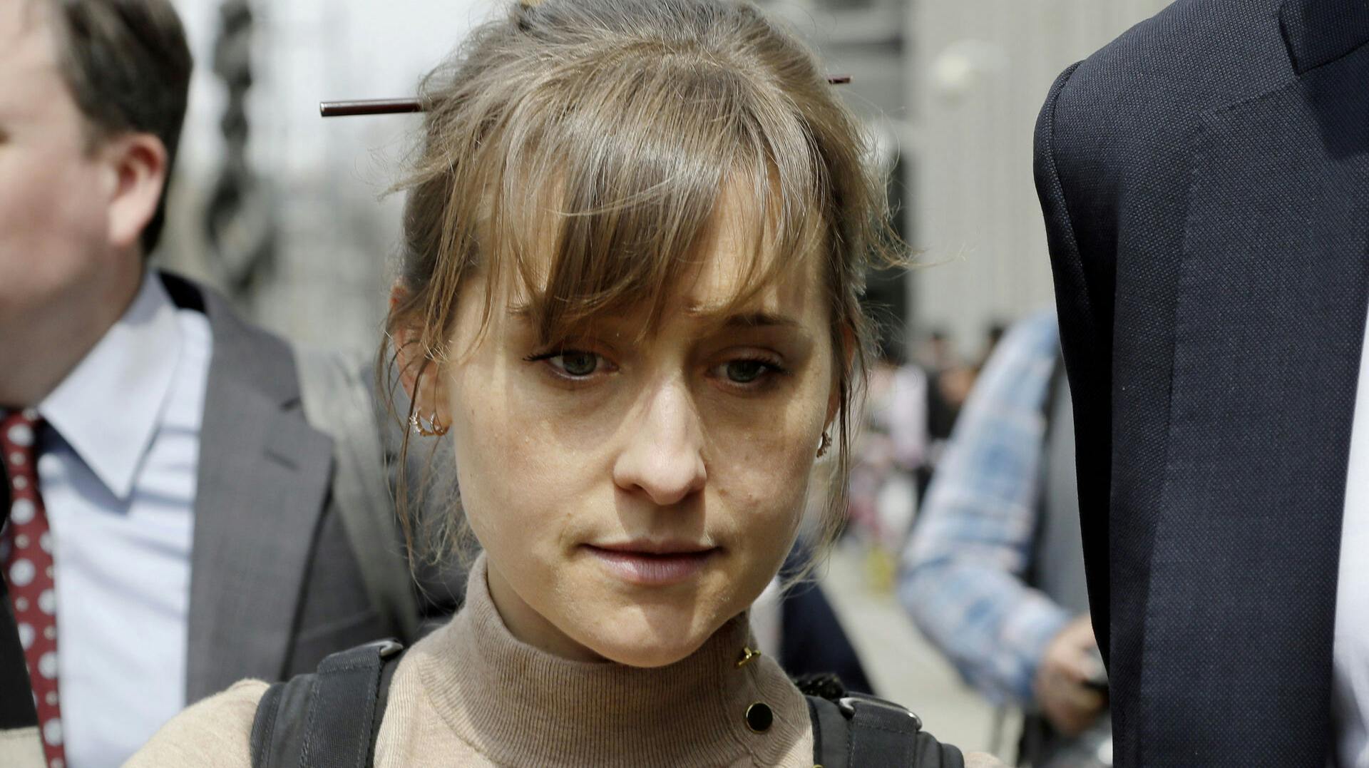 FILE - Television actor Allison Mack leaves f