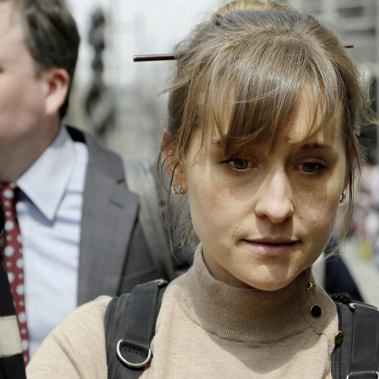 FILE - Television actor Allison Mack leaves federal court in the Brooklyn borough of New York, April 8, 2019, after pleading guilty to racketeering charges in a case involving a cult-like group based in upstate New York called NXIVM. Mack has been released from a California prison, according to a government website. Online records maintained by the Federal Bureau of Prisons said she was released Monday, July 3, 2023. (AP Photo/Mark Lennihan, File)