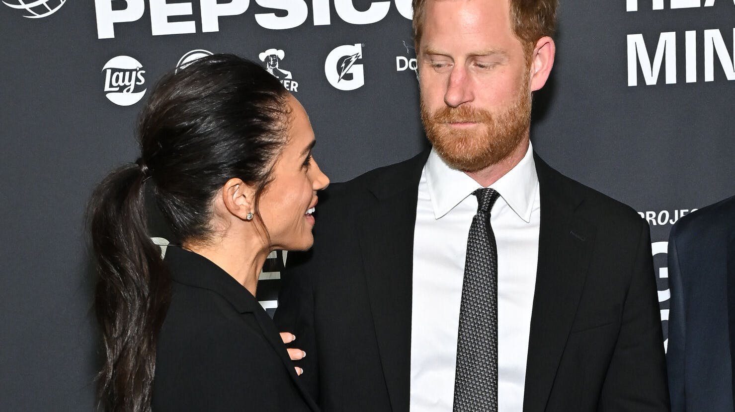 Meghan Markle, left, and Prince Harry, The Duke and Duchess of Sussex, attend the third annual World Mental Health Day Gala, hosted by Project Healthy Minds, at Spring Studios on Thursday, Oct. 9, 2025, in New York. (Photo by Evan Agostini/Invision/AP)