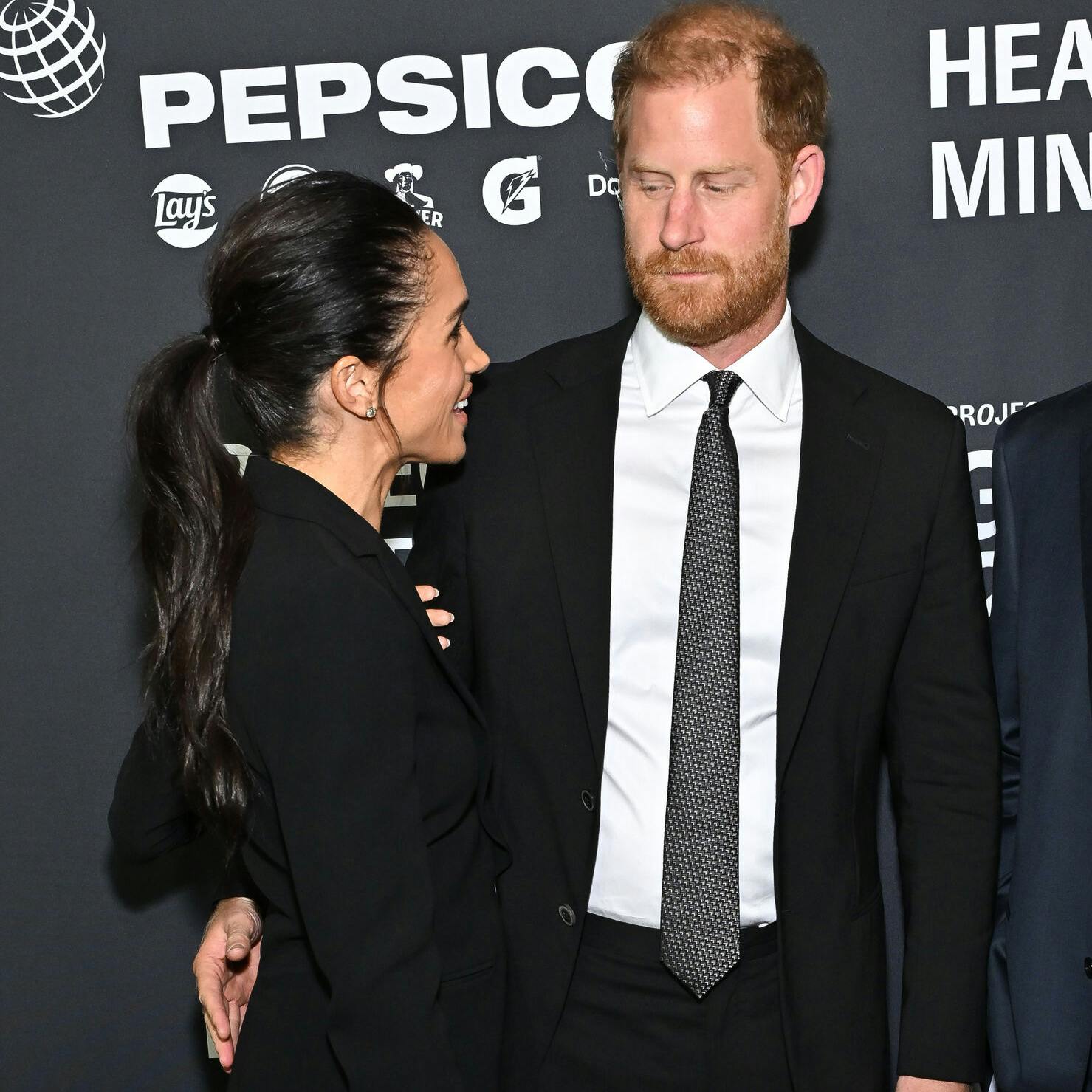 Meghan Markle, left, and Prince Harry, The Duke and Duchess of Sussex, attend the third annual World Mental Health Day Gala, hosted by Project Healthy Minds, at Spring Studios on Thursday, Oct. 9, 2025, in New York. (Photo by Evan Agostini/Invision/AP)