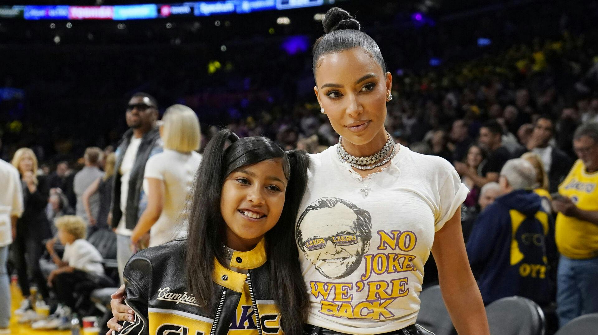 FILE - Kim Kardashian poses for a photo with d