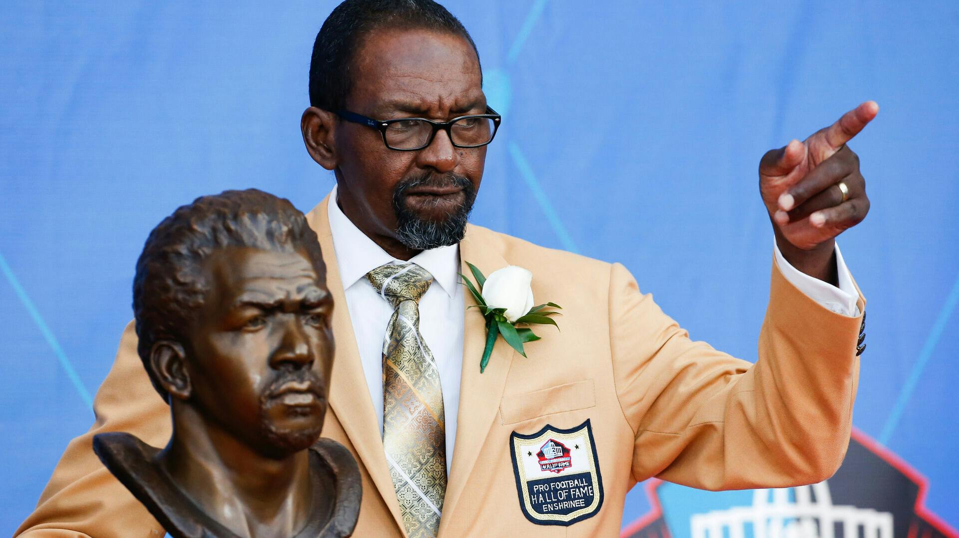 FILE - Former NFL player Kenny Easley poses with a bust of himself during an induction ceremony at the Pro Football Hall of Fame, Saturday, Aug. 5, 2017, in Canton, Ohio. (AP Photo/Ron Schwane, File)