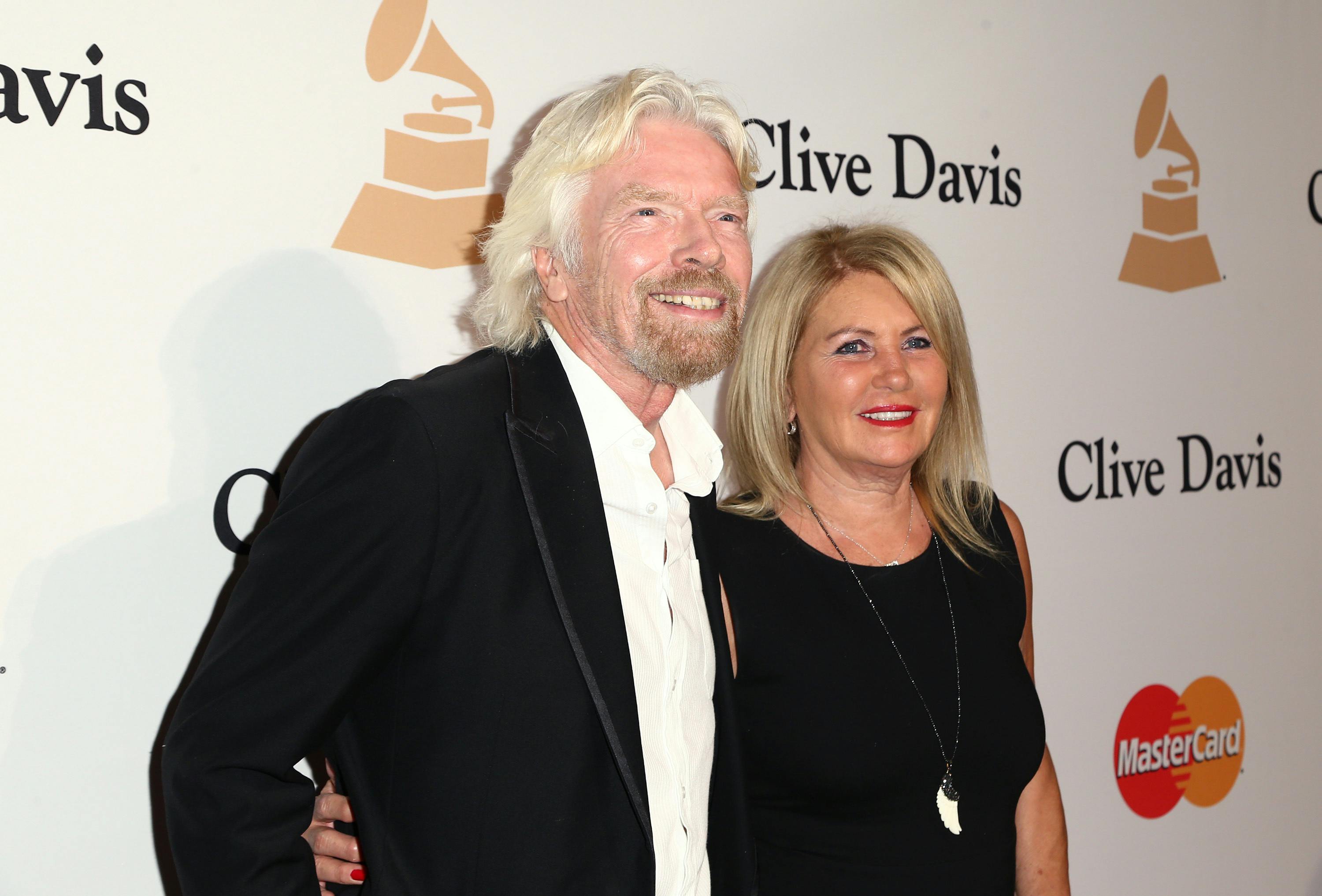 Richard Branson, left, and Joan Templeman arrive at the 2016 Clive Davis Pre-Grammy Gala at the Beverly Hilton Hotel on Sunday, Feb. 14, 2016, in Beverly Hills, Calif. (Photo by John Salangsang/Invision/AP)