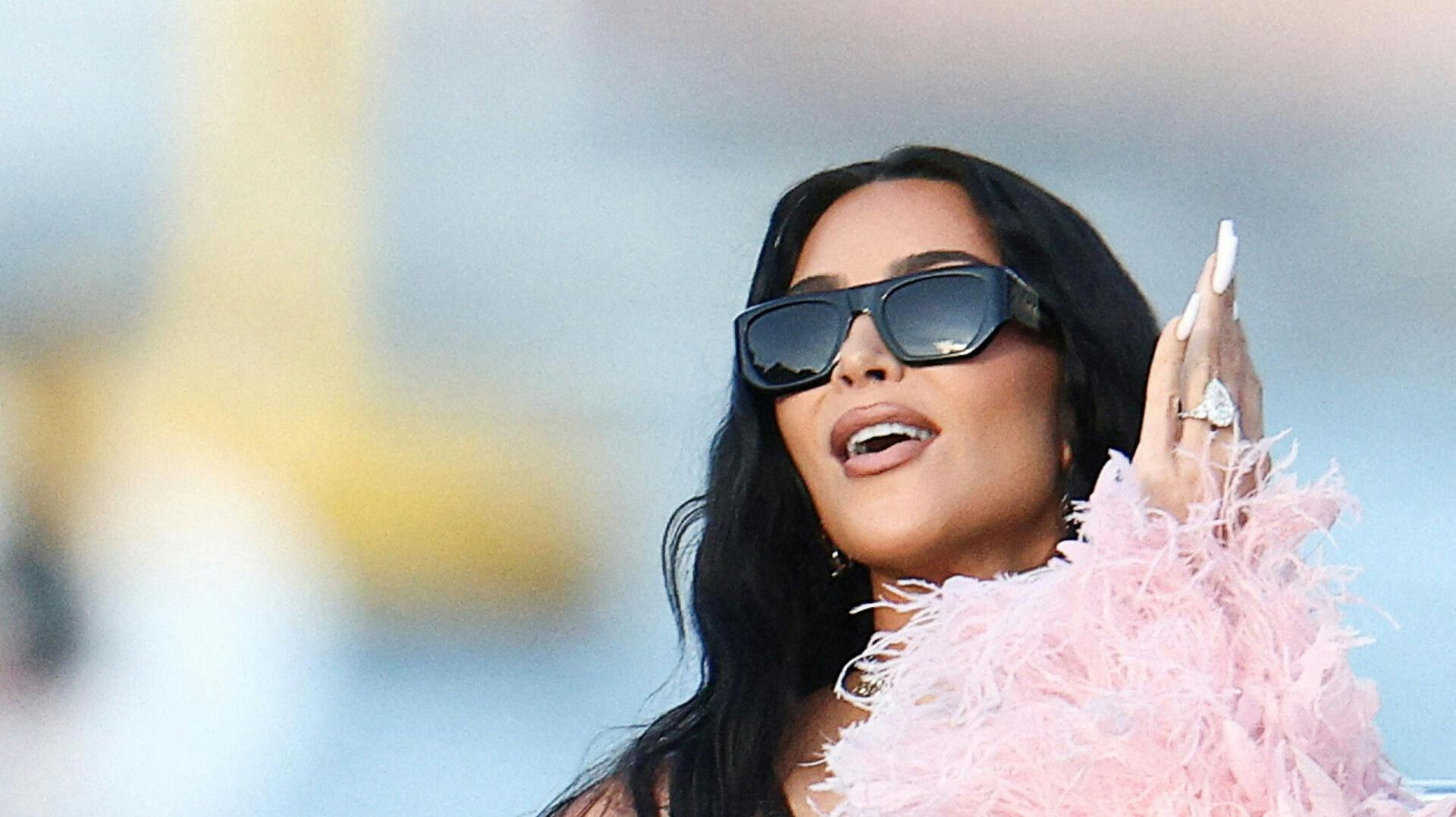 FILE PHOTO: Kim Kardashian travels on a boat, on the second day of the wedding festivities of Amazon founder Jeff Bezos and journalist Lauren Sanchez, in Venice, Italy, June 27, 2025. REUTERS/Guglielmo Mangiapane/File Photo