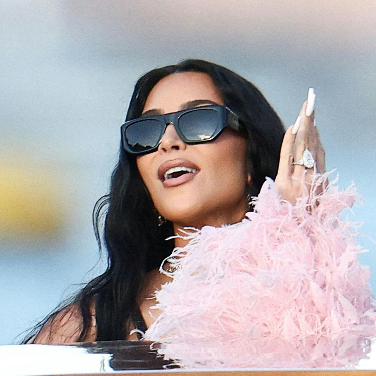 FILE PHOTO: Kim Kardashian travels on a boat, on the second day of the wedding festivities of Amazon founder Jeff Bezos and journalist Lauren Sanchez, in Venice, Italy, June 27, 2025. REUTERS/Guglielmo Mangiapane/File Photo